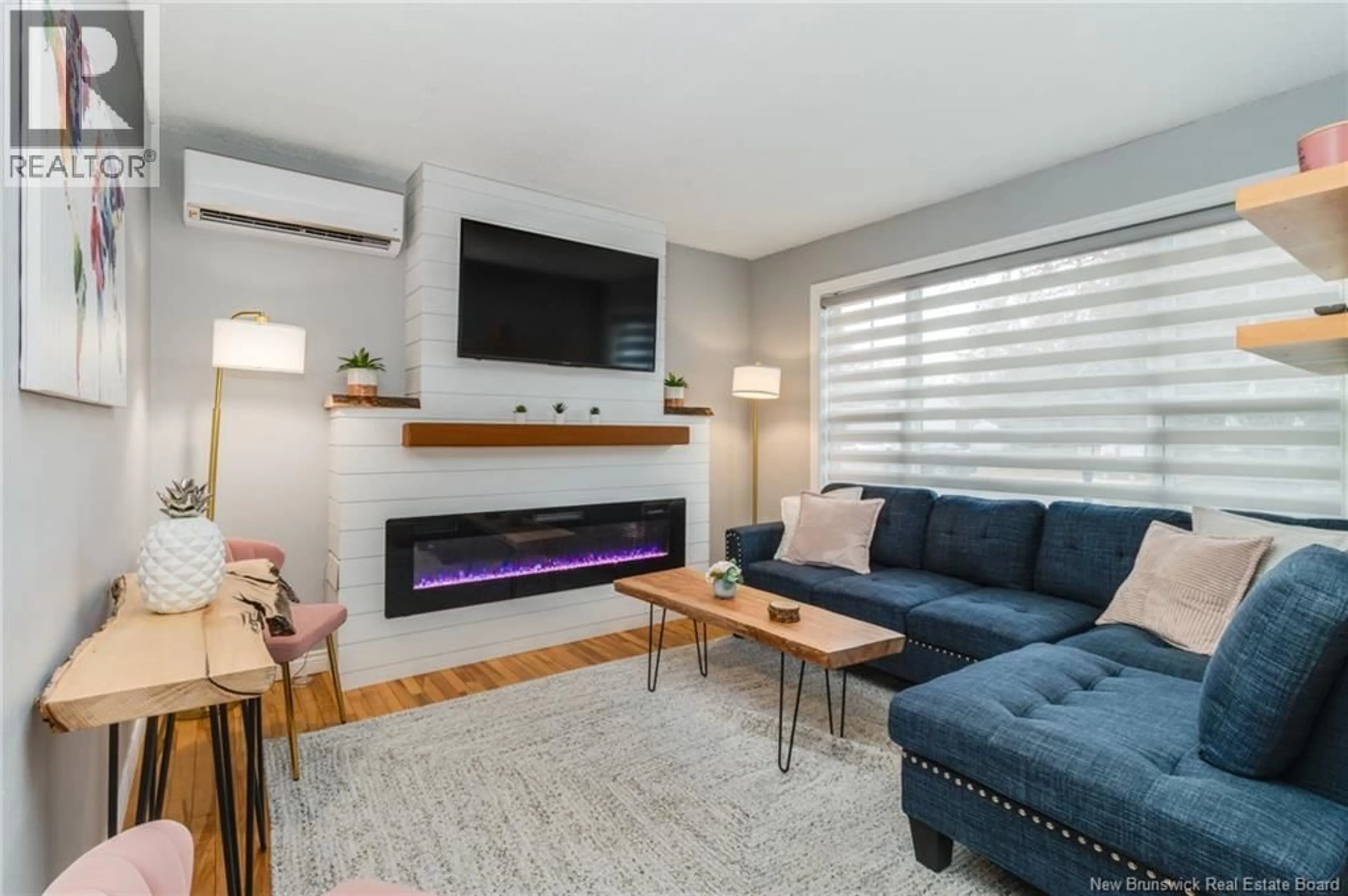 Living room with furniture, wood/laminate floor for 12 DOHERTY STREET, New Maryland New Brunswick E3C1C3