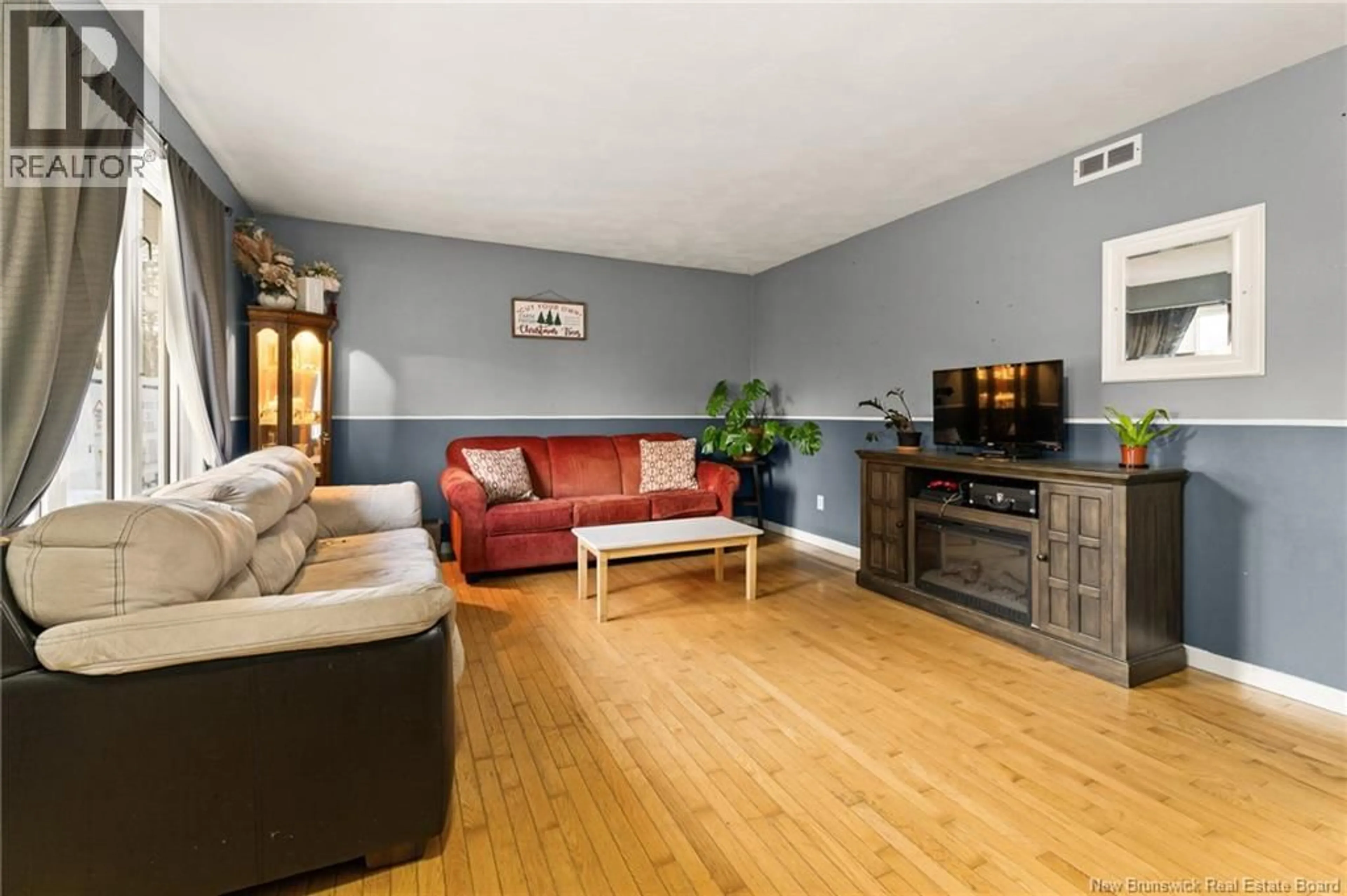 Living room with furniture, wood/laminate floor for 235 PASCAL, Dieppe New Brunswick E1A2C8
