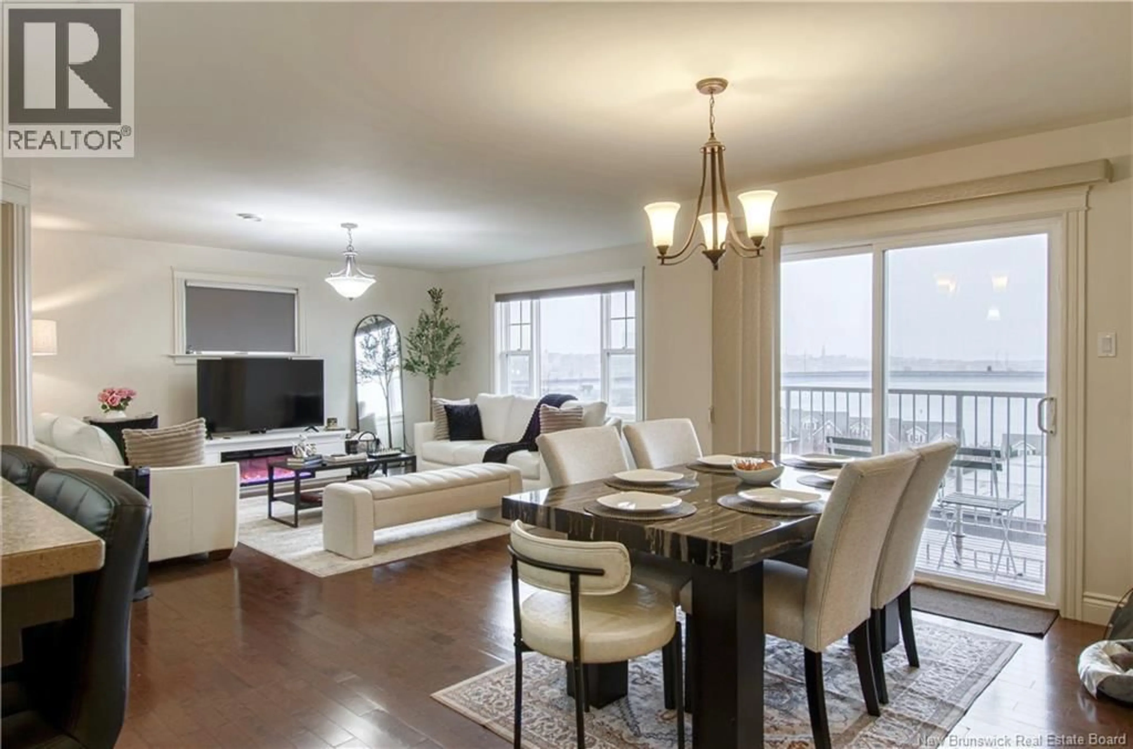 Living room with furniture, wood/laminate floor for 304 - 20 KING GEORGE COURT, Saint John New Brunswick E2K0H5