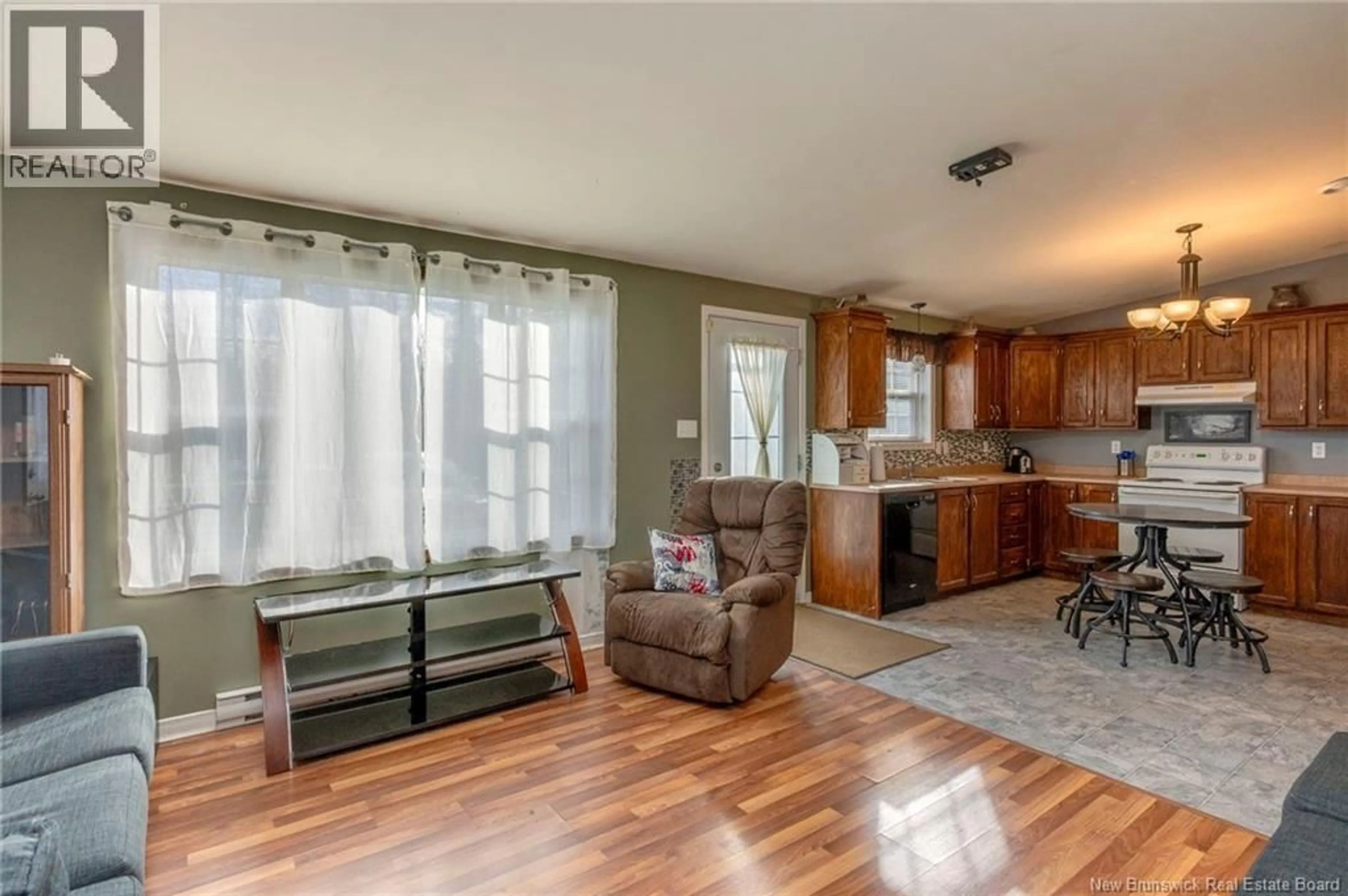 Living room with furniture, wood/laminate floor for 8 ANGUS LANE, Riverview New Brunswick E1B5L9