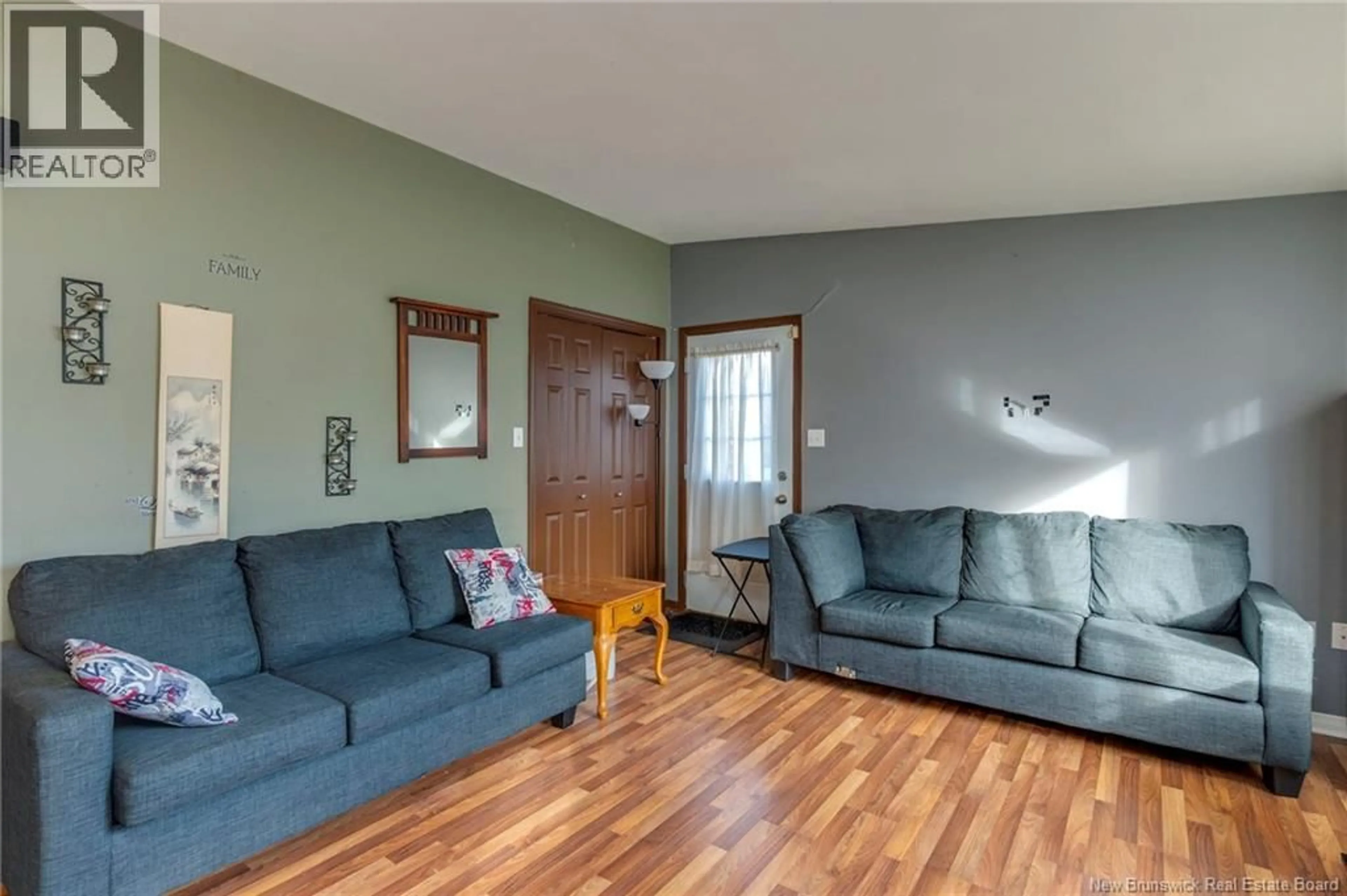 Living room with furniture, wood/laminate floor for 8 ANGUS LANE, Riverview New Brunswick E1B5L9