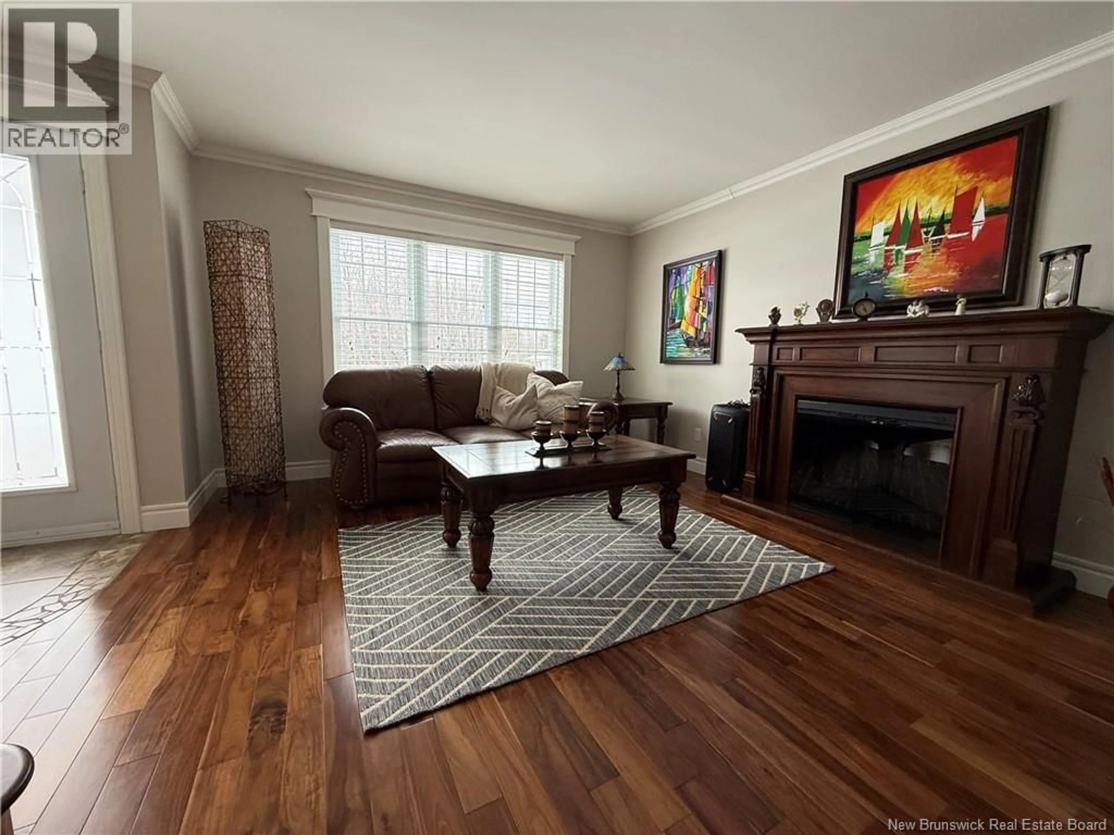 Living room with furniture, wood/laminate floor for 2010 WELLINGTON AVENUE, Bathurst New Brunswick E2A4X8
