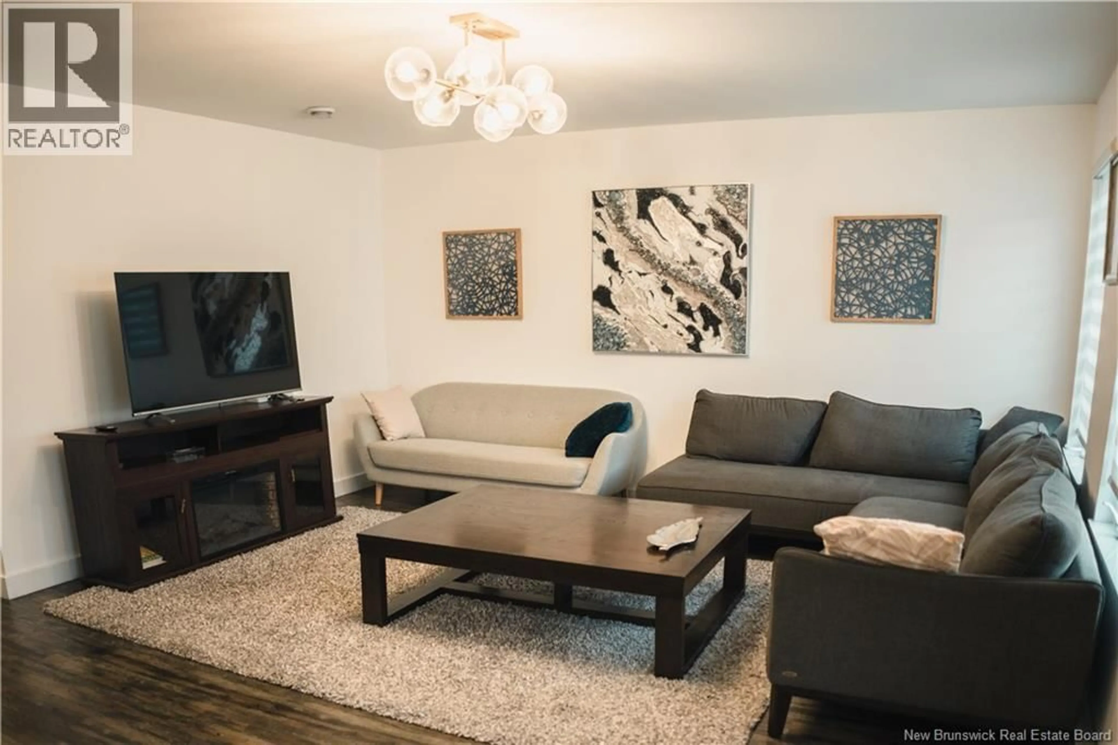 Living room with furniture, wood/laminate floor for 135 WATERLOO STREET, Saint John New Brunswick E2L0E8