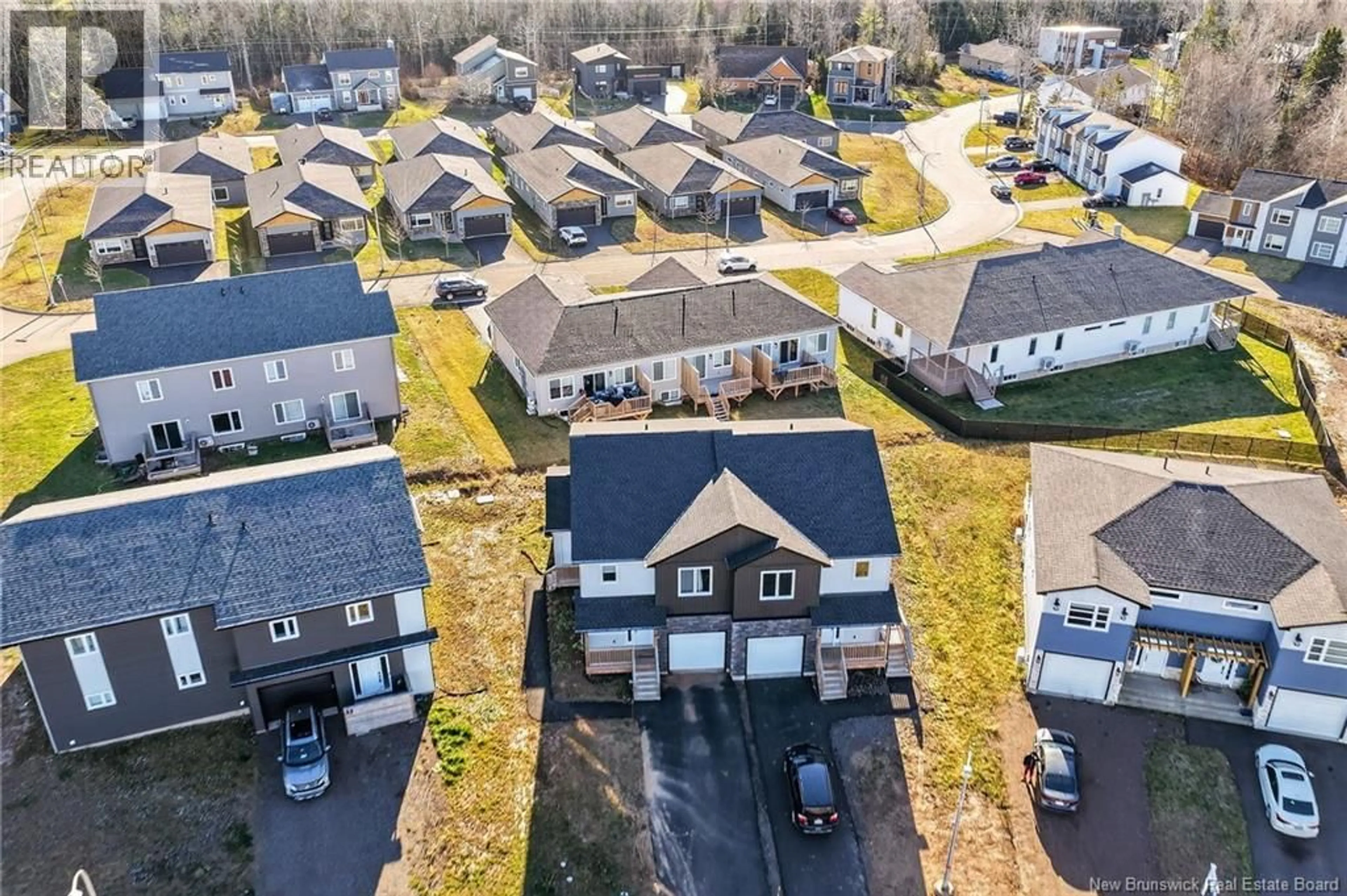 A pic from outside/outdoor area/front of a property/back of a property/a pic from drone, street for 18 SOLAIRE PASSAGE, Moncton New Brunswick E1A7V1