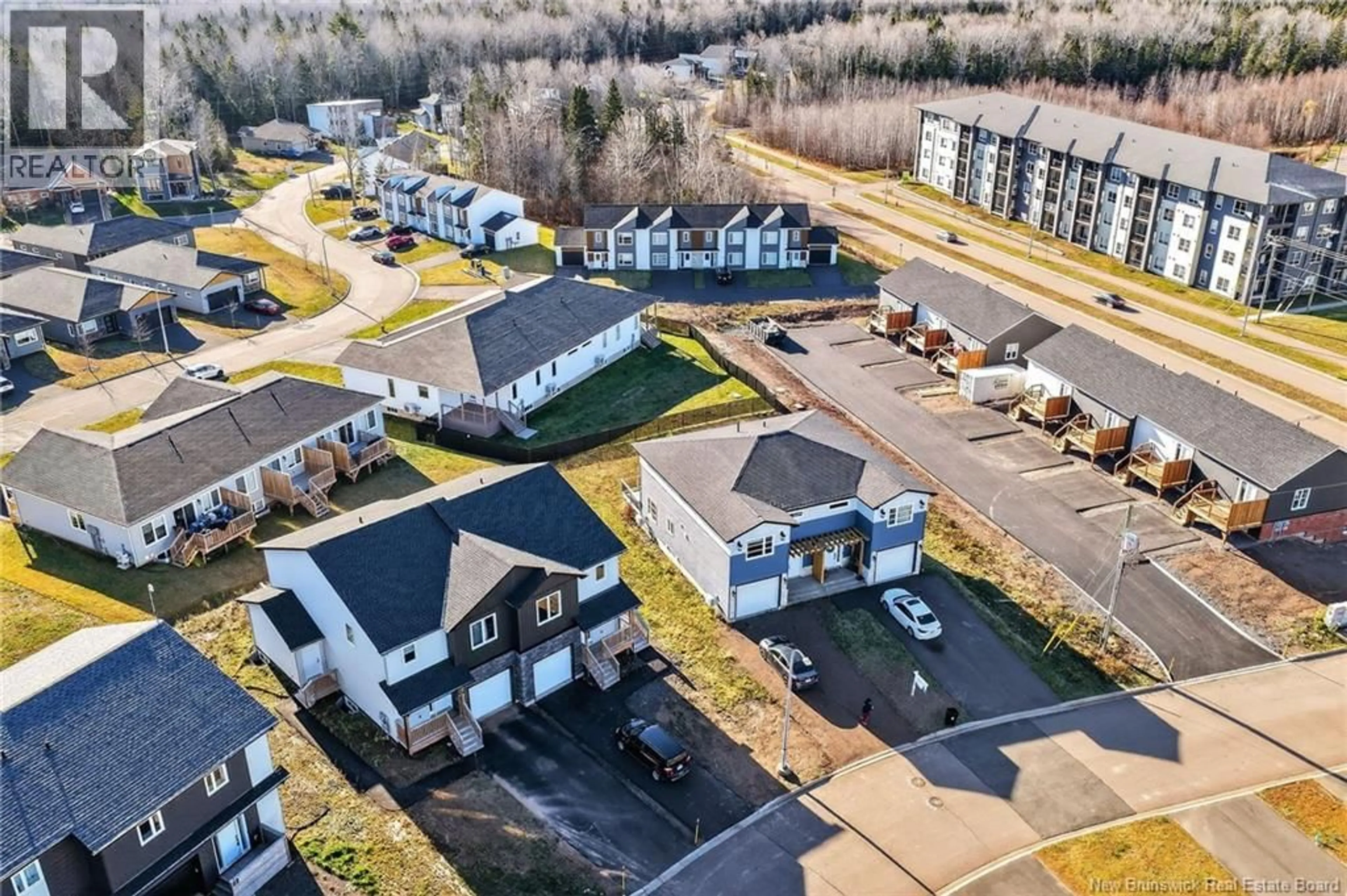 A pic from outside/outdoor area/front of a property/back of a property/a pic from drone, unknown for 18 SOLAIRE PASSAGE, Moncton New Brunswick E1A7V1