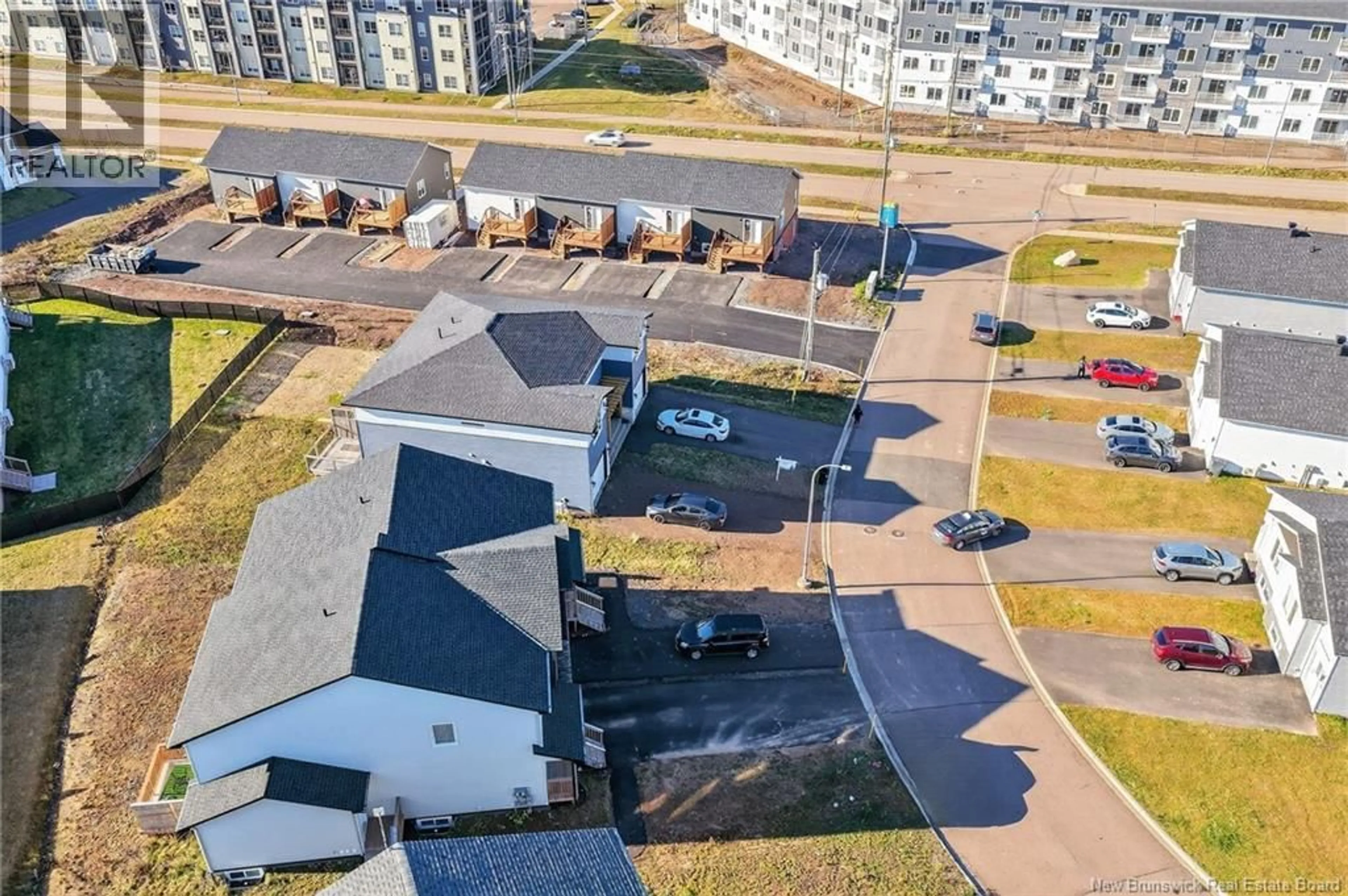 A pic from outside/outdoor area/front of a property/back of a property/a pic from drone, city buildings view from balcony for 18 SOLAIRE PASSAGE, Moncton New Brunswick E1A7V1
