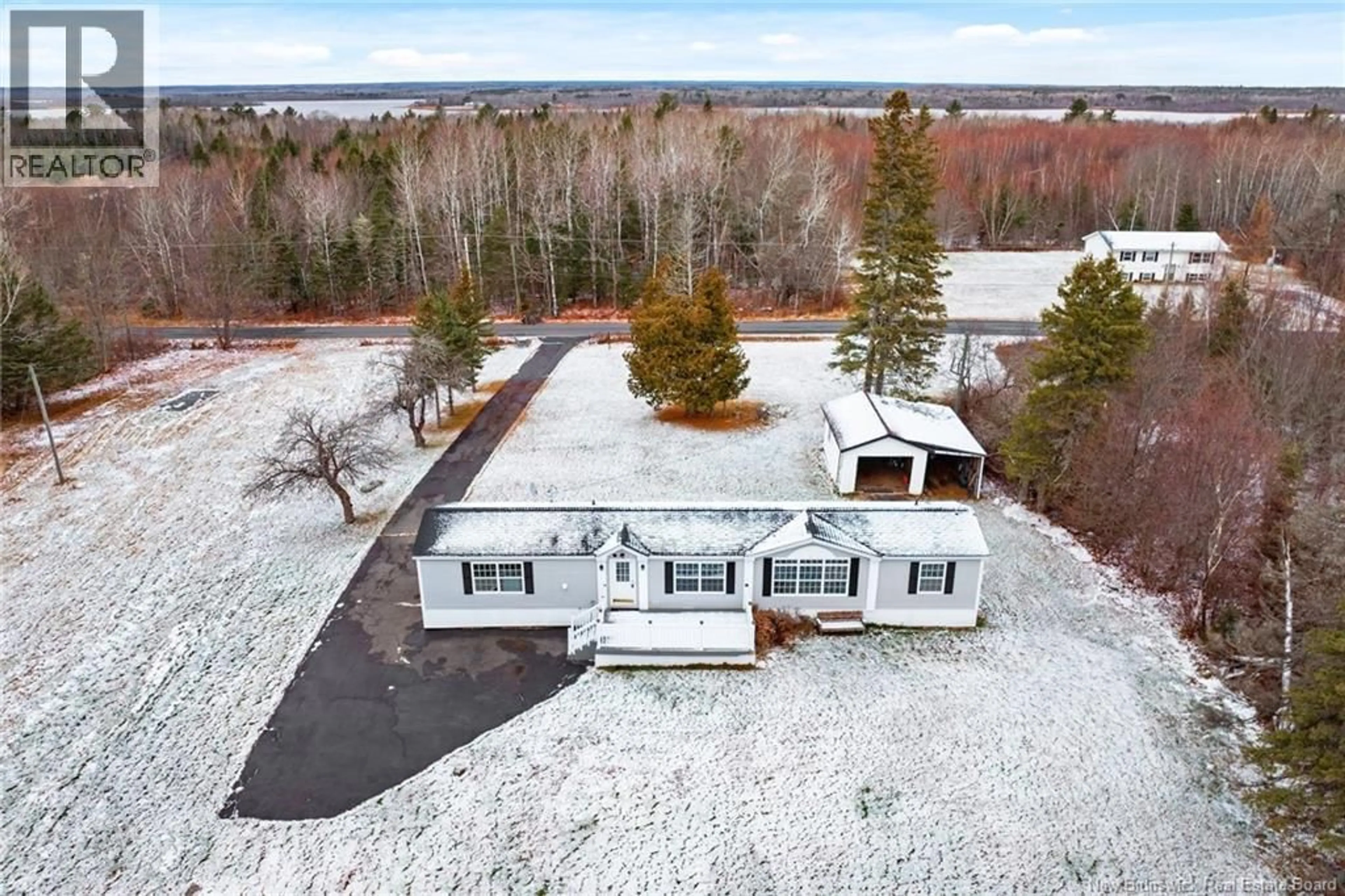 A pic from outside/outdoor area/front of a property/back of a property/a pic from drone, unknown for 19 COX POINT ROAD, Cumberland Bay New Brunswick E4A2X1