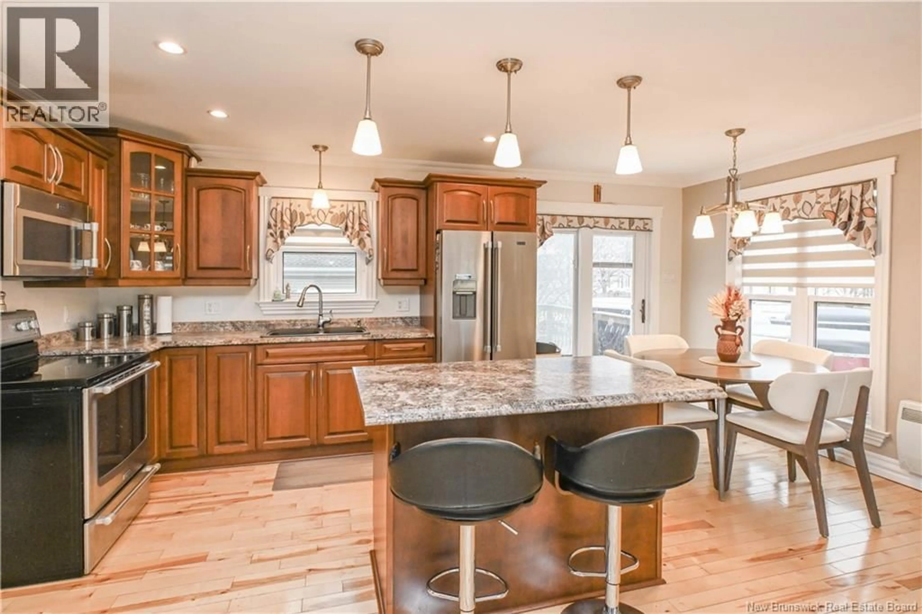 Open concept kitchen, ceramic/tile floor for 8 RUE HACHÉ, Caraquet New Brunswick E1W1A4