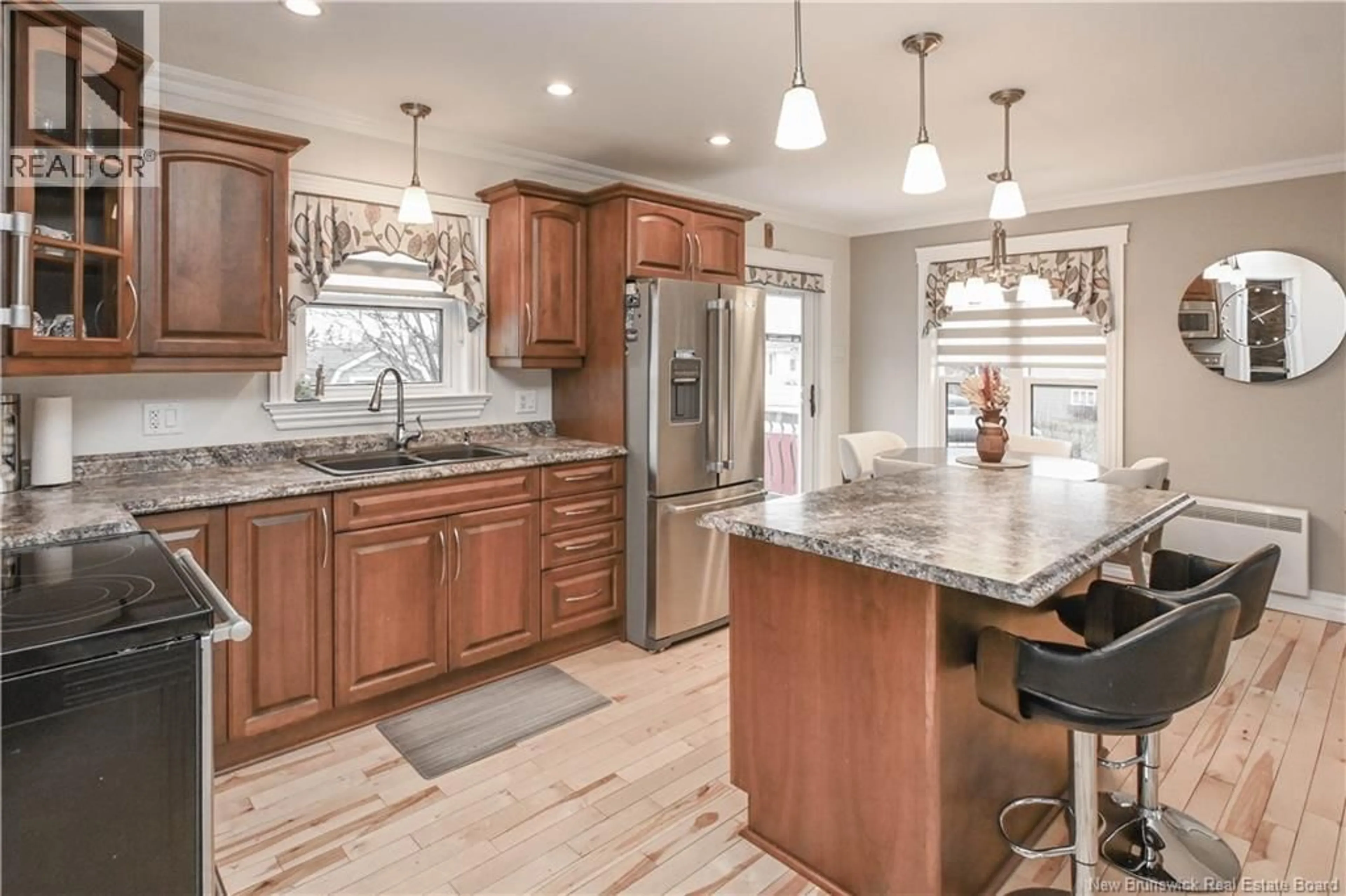 Open concept kitchen, ceramic/tile floor for 8 RUE HACHÉ, Caraquet New Brunswick E1W1A4