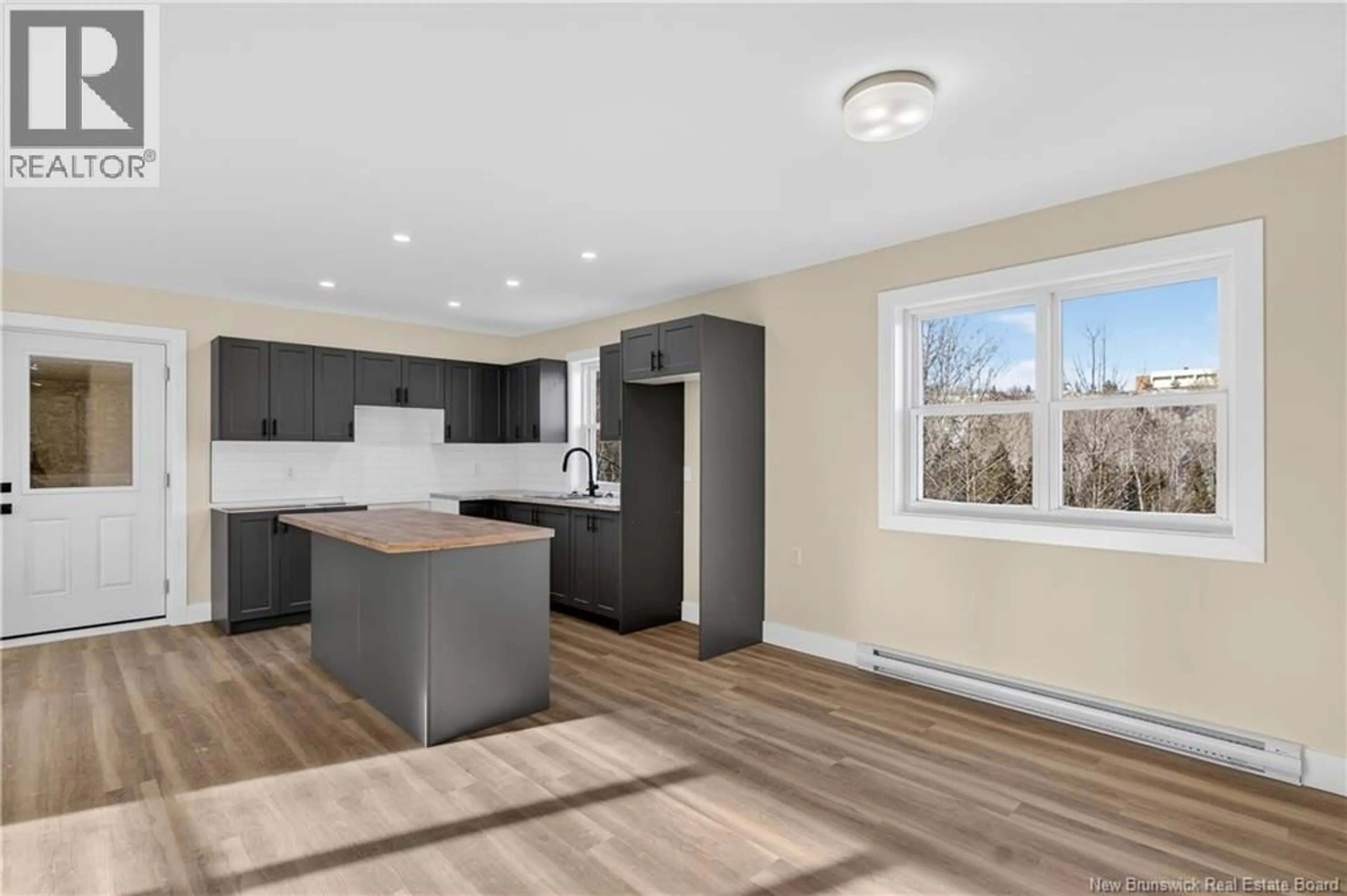 Open concept kitchen, wood/laminate floor for 443 BLANCHARD STREET, Dalhousie New Brunswick E8C1G1