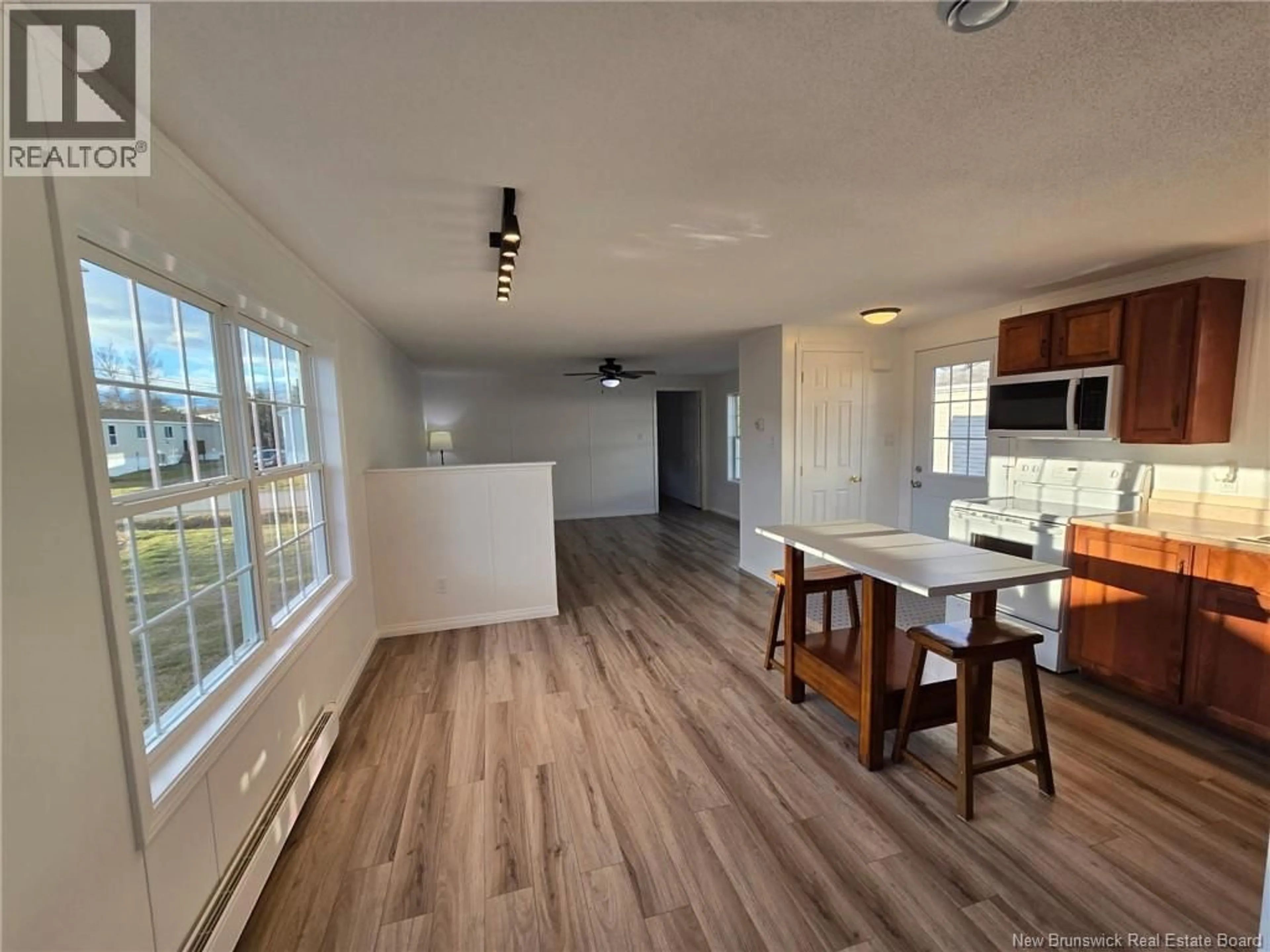 Open concept kitchen, wood/laminate floor for 97 EVERGREEN STREET, Fredericton New Brunswick E3B6N1