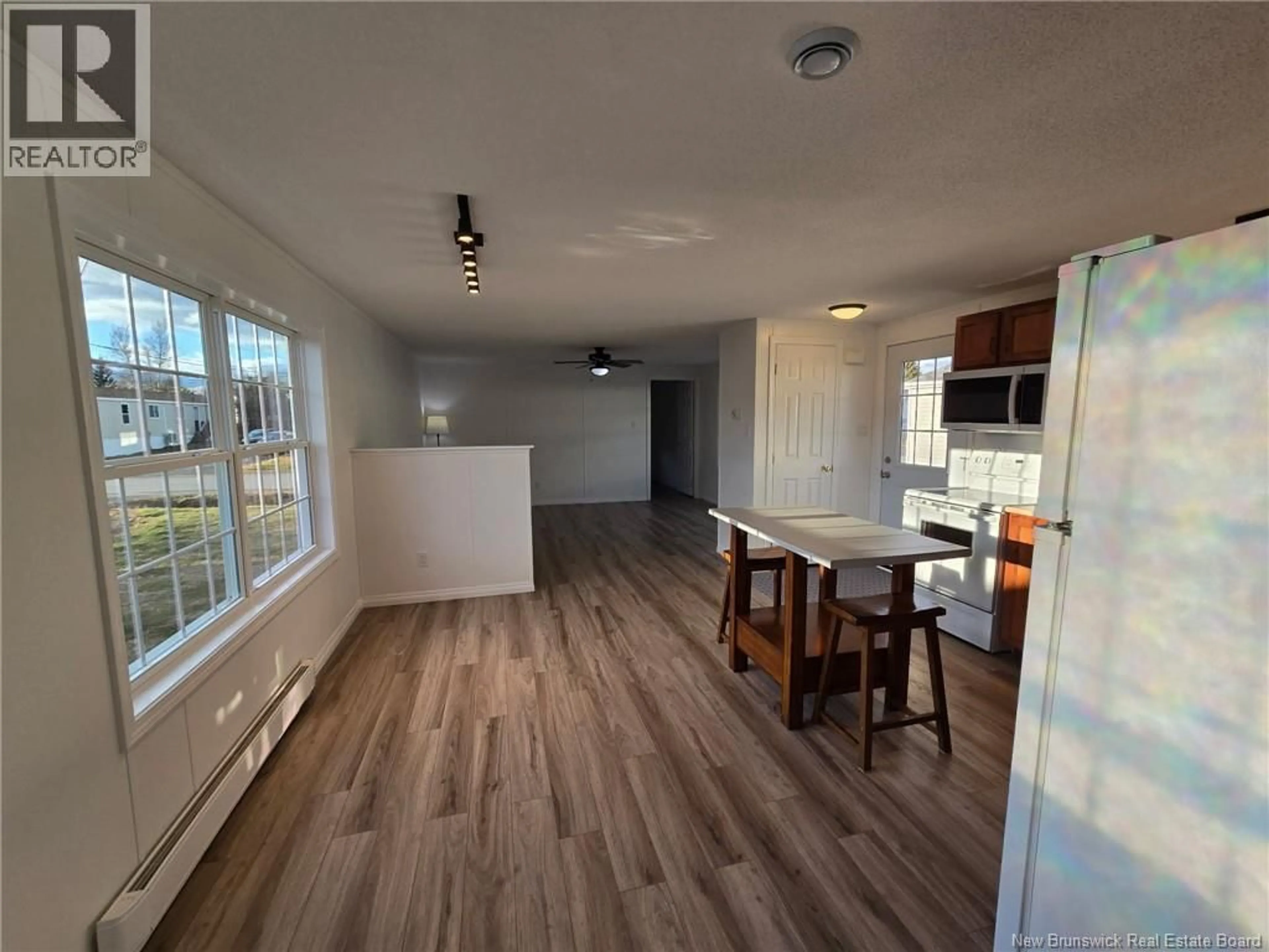 Open concept kitchen, wood/laminate floor for 97 EVERGREEN STREET, Fredericton New Brunswick E3B6N1