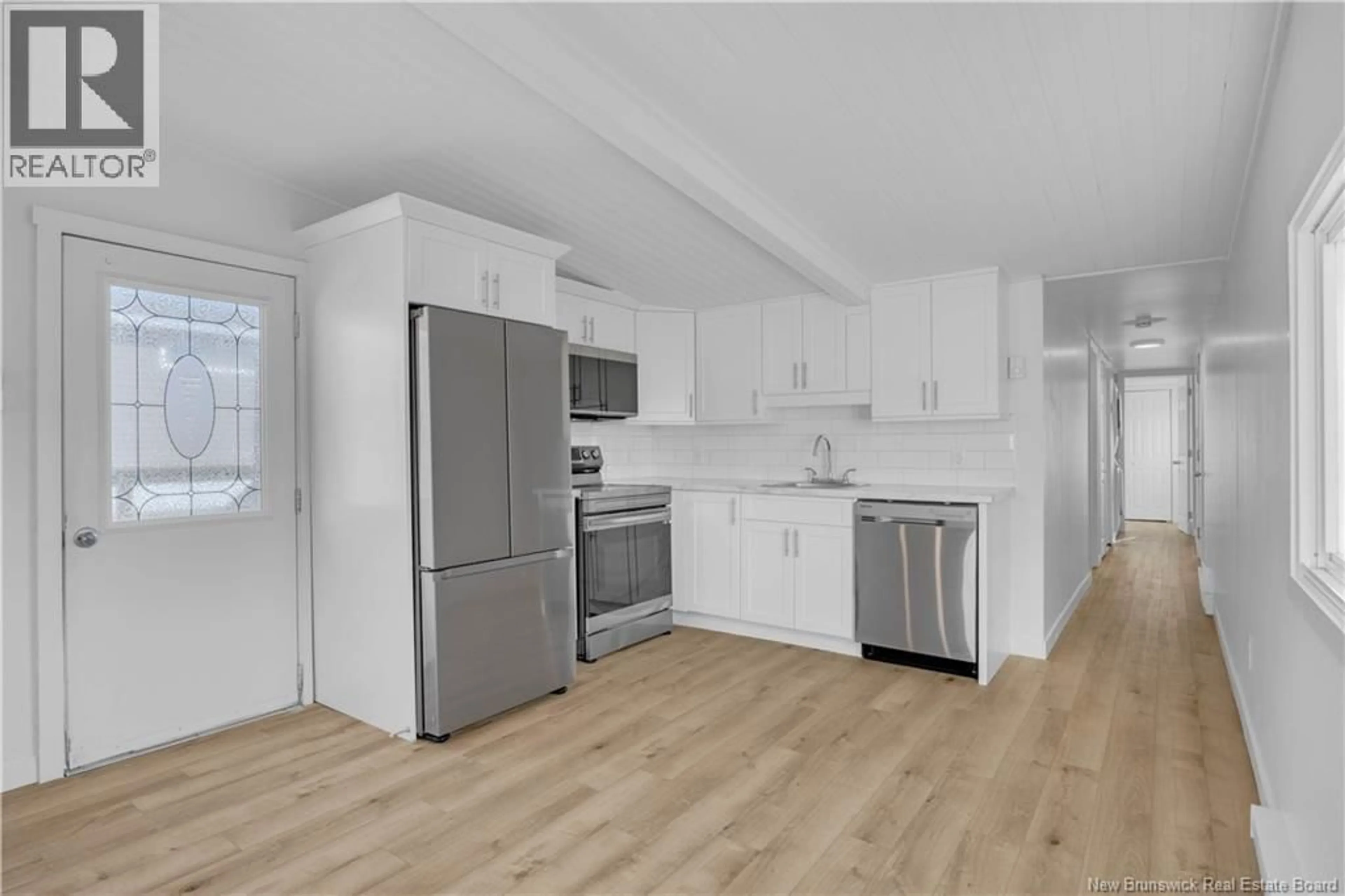 Open concept kitchen, wood/laminate floor for 44B DWAYNE AVENUE, Quispamsis New Brunswick E2G1S8