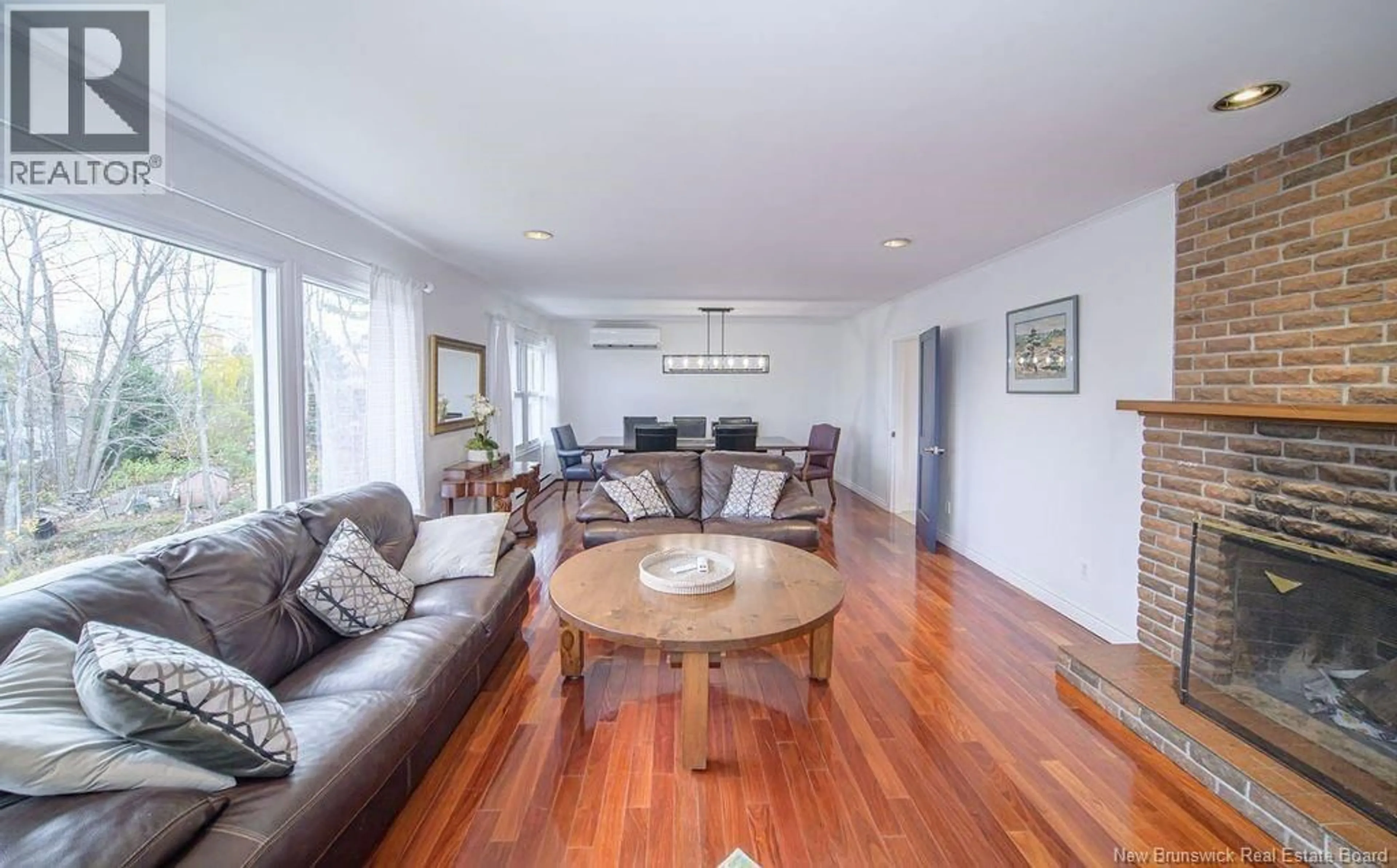 Living room with furniture, wood/laminate floor for 31 FOREST ACRES COURT, Fredericton New Brunswick E3B4L2
