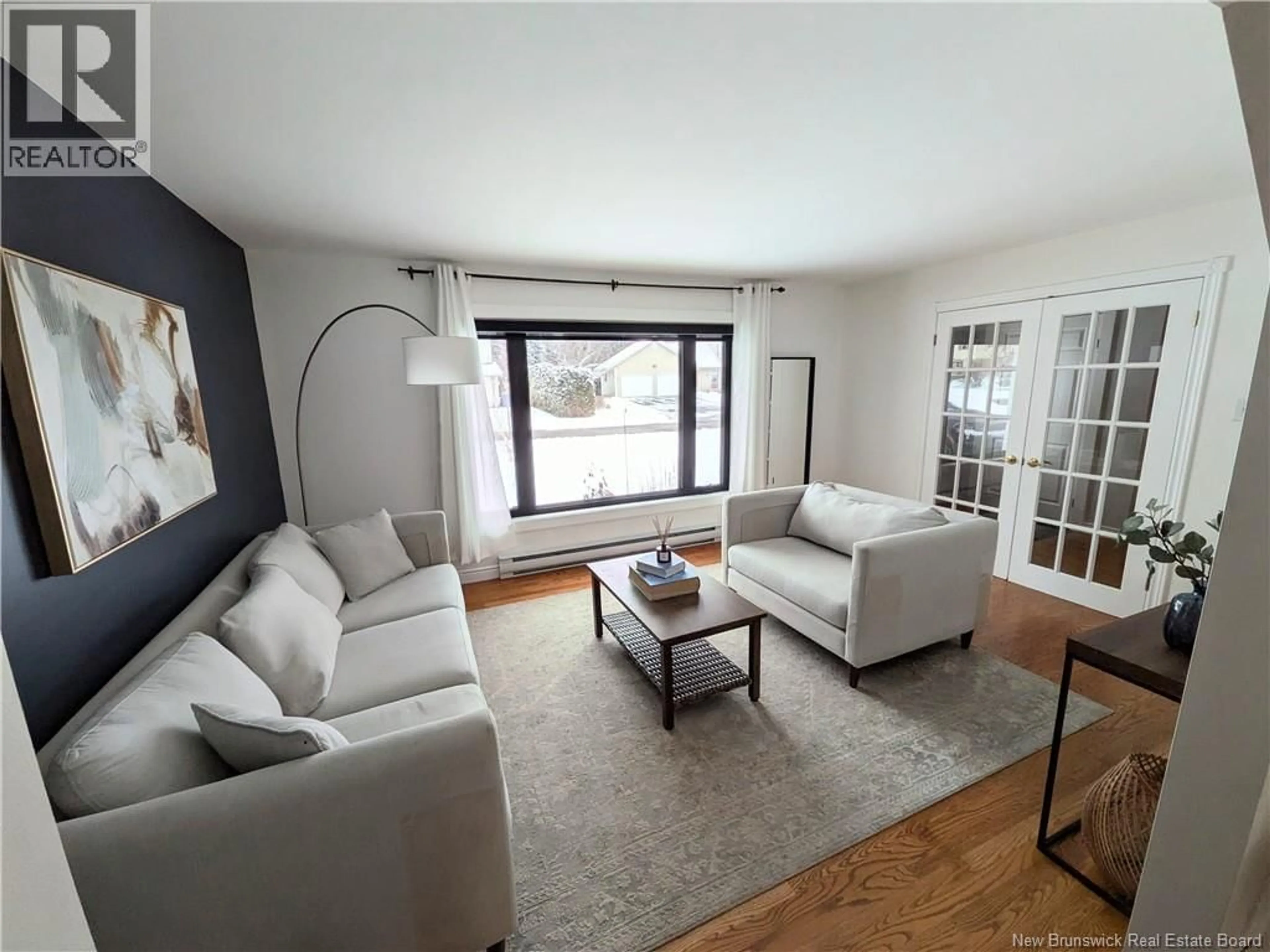 Living room with furniture, wood/laminate floor for 103 SQUIRES STREET, Woodstock New Brunswick E7M2S4