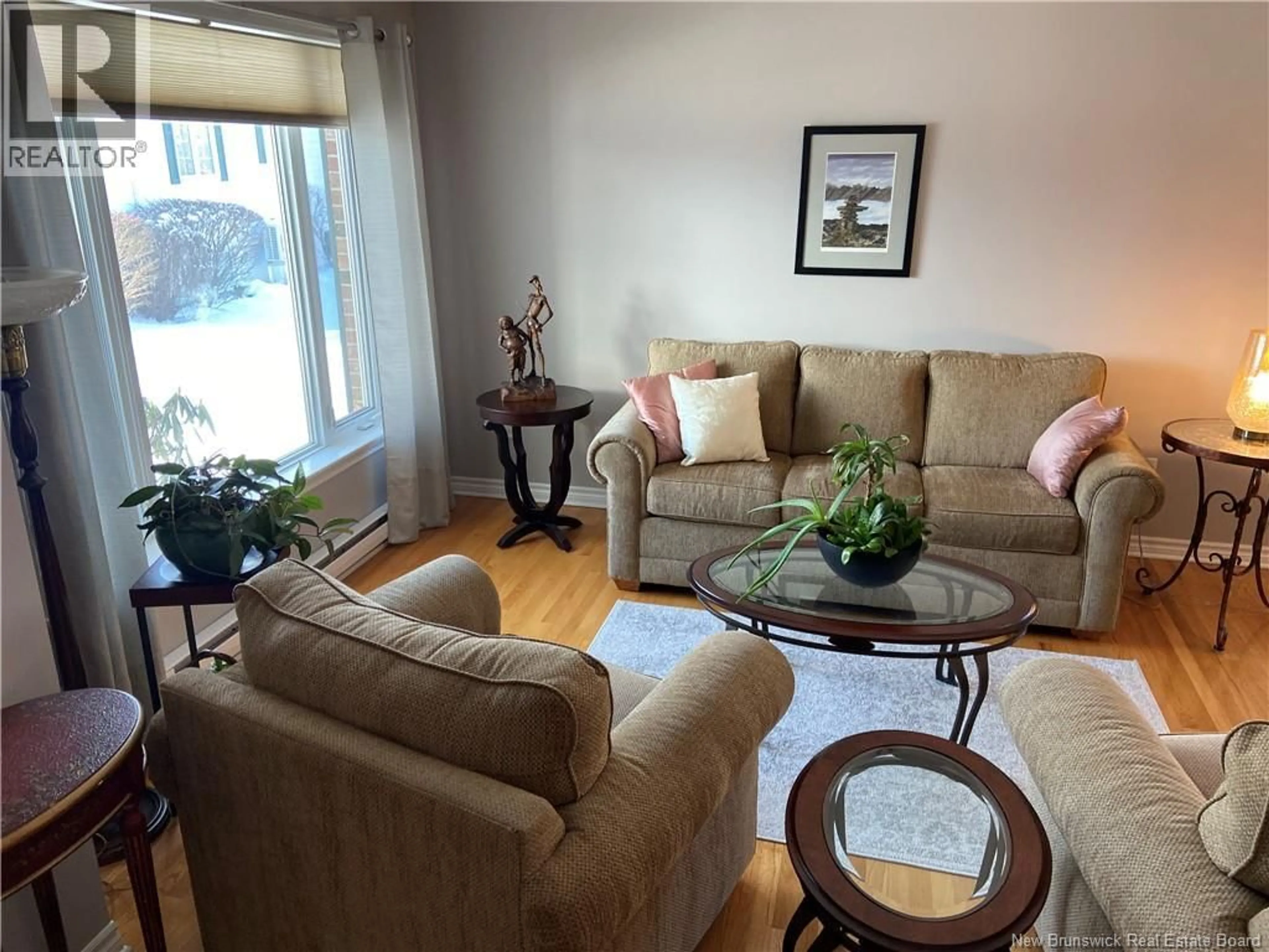 Living room with furniture, wood/laminate floor for 22 WHITE HOUSE COURT, Saint John New Brunswick E2M5Z8