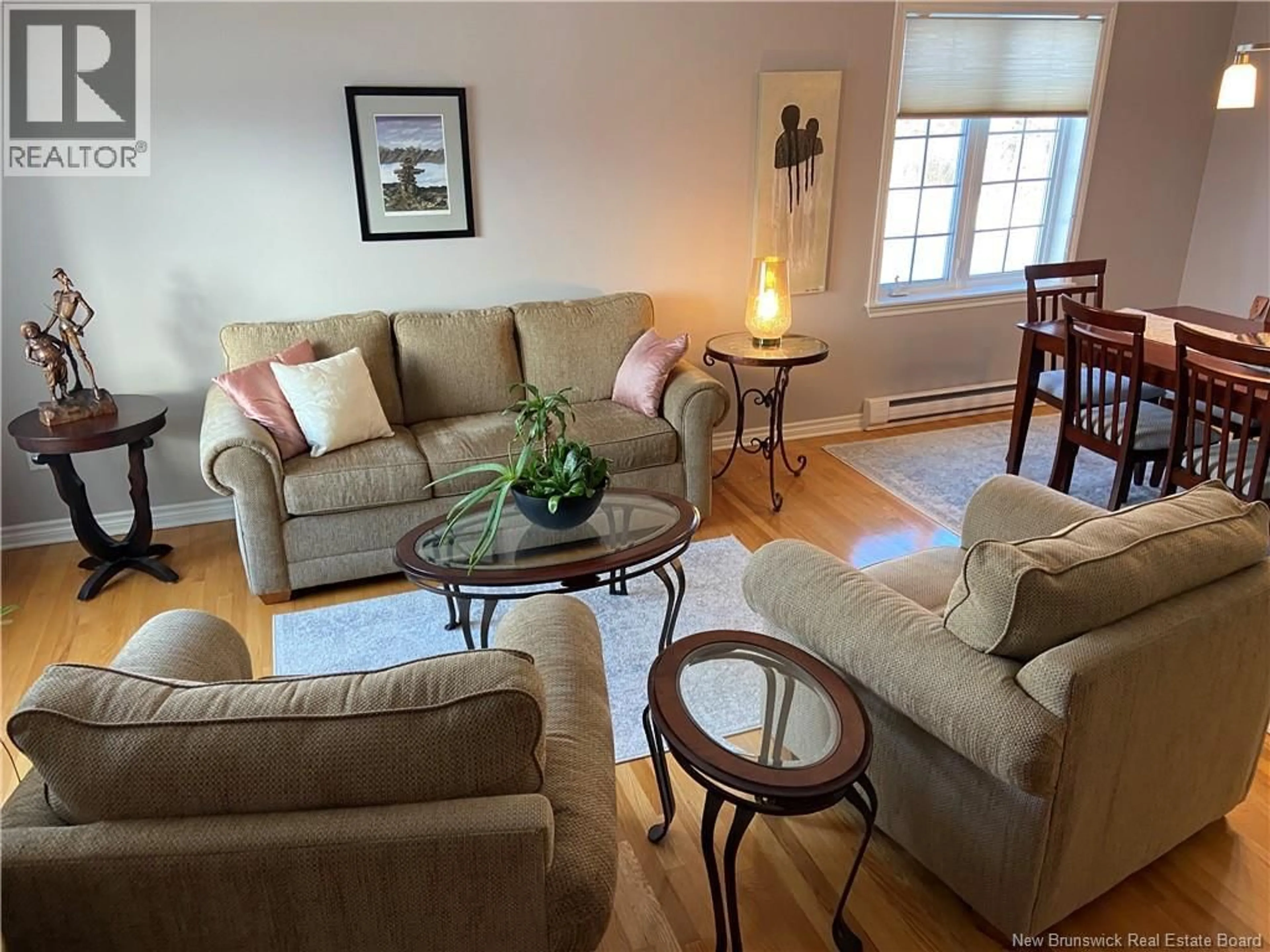 Living room with furniture, wood/laminate floor for 22 WHITE HOUSE COURT, Saint John New Brunswick E2M5Z8