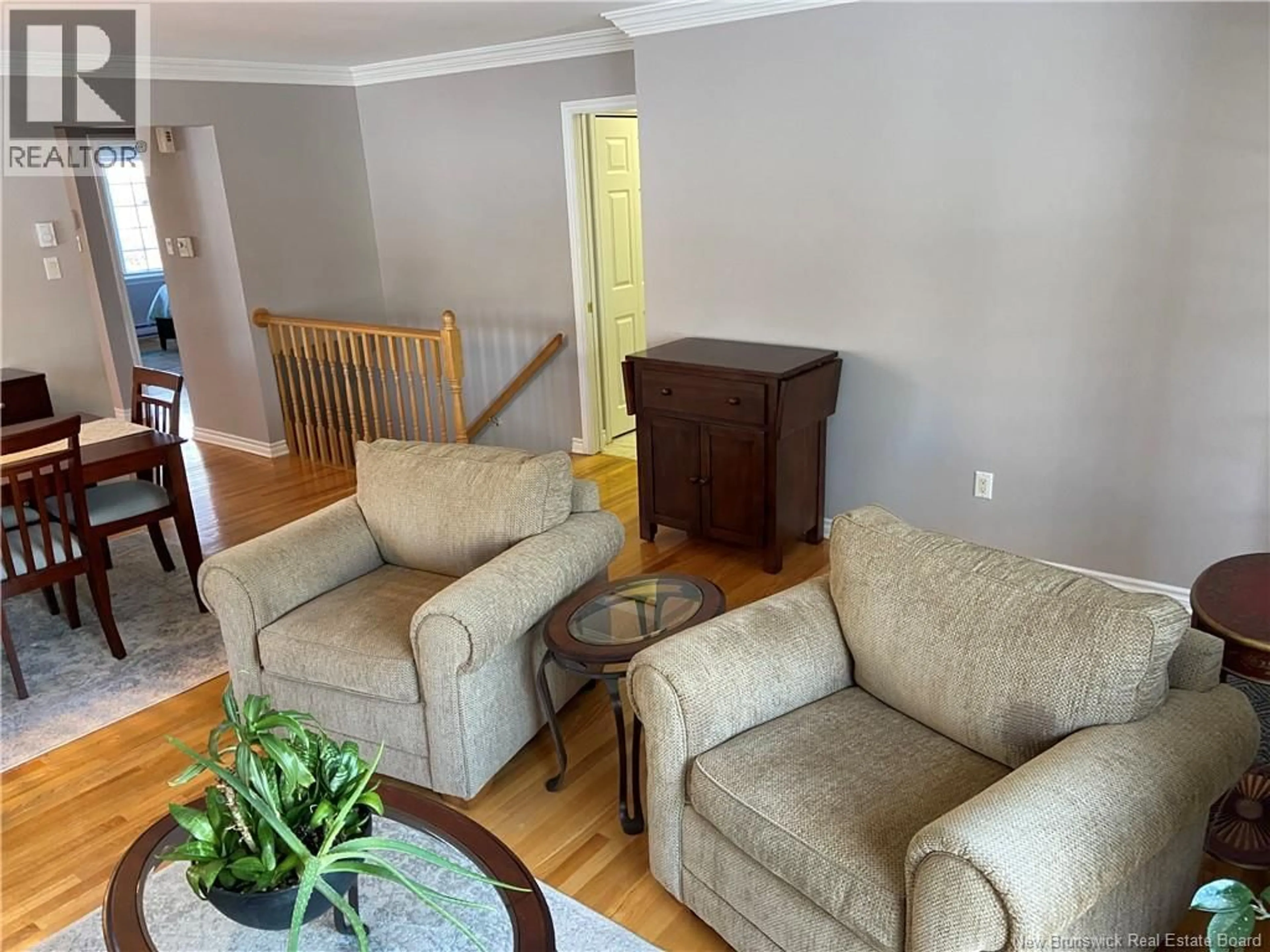 Living room with furniture, wood/laminate floor for 22 WHITE HOUSE COURT, Saint John New Brunswick E2M5Z8