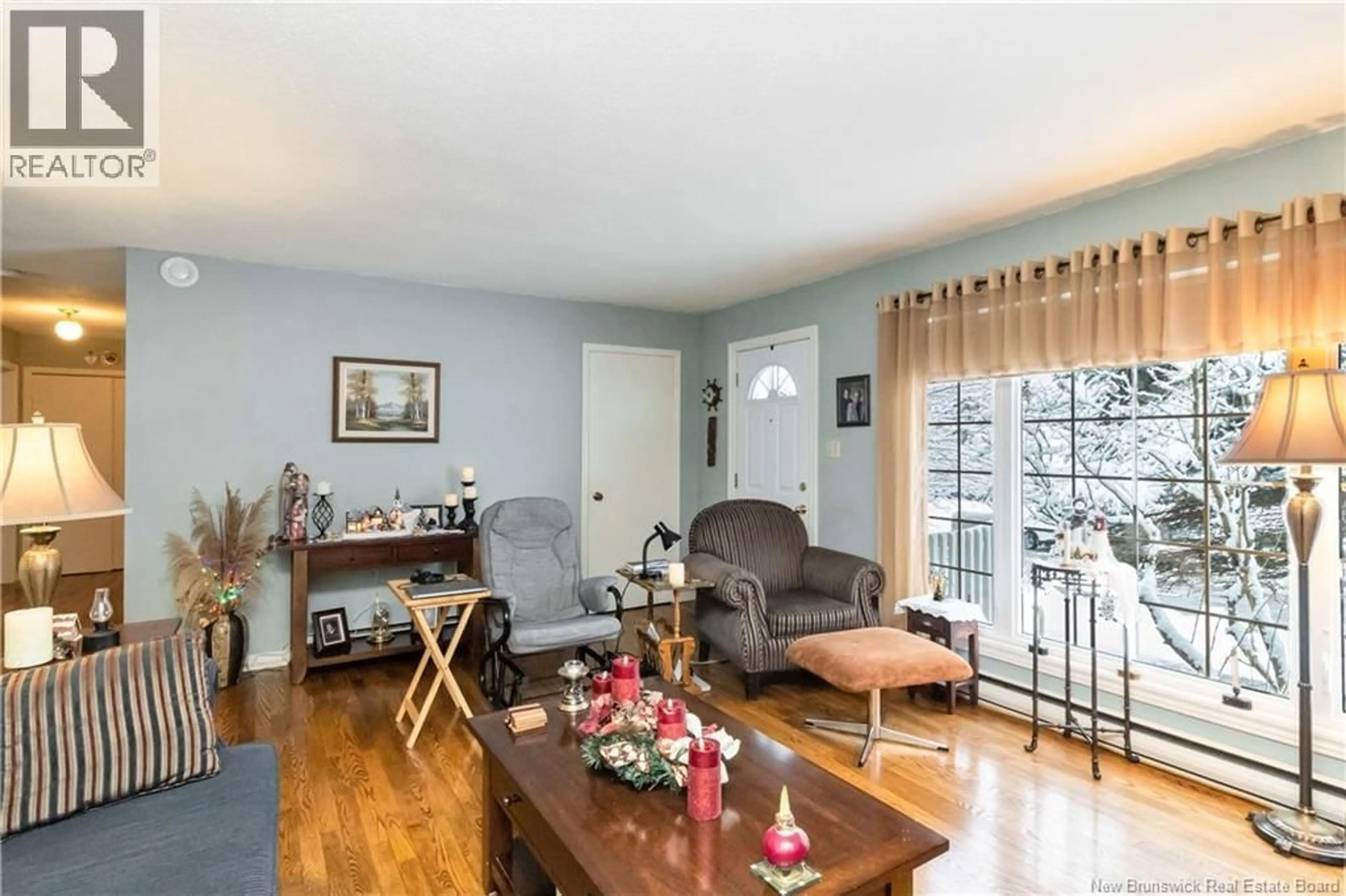 Living room with furniture, wood/laminate floor for 139 DAWN CRESCENT, Moncton New Brunswick E1G1K9