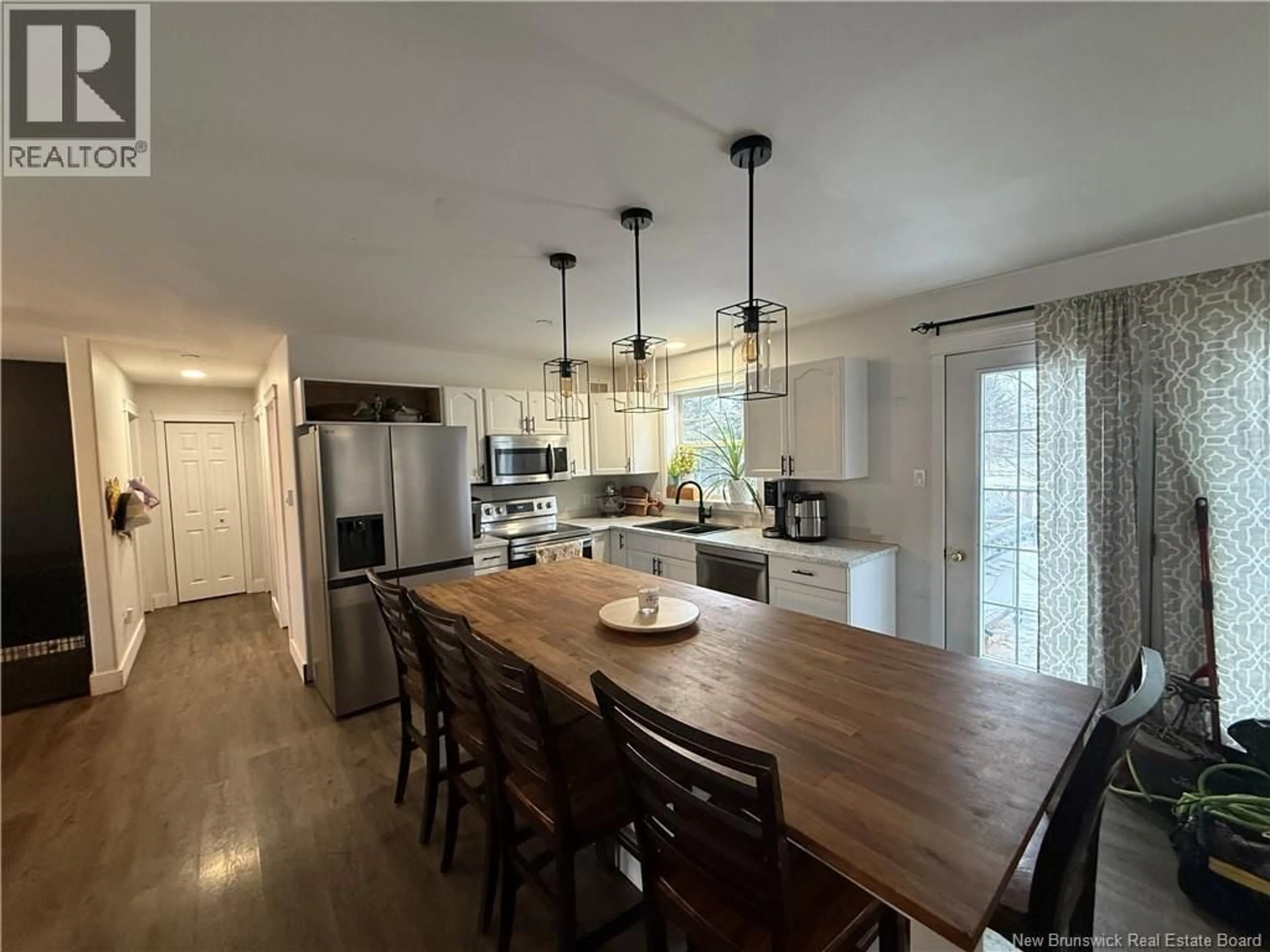 Open concept kitchen, wood/laminate floor for 145 EASTWOOD DRIVE, Woodstock New Brunswick E7M1P7
