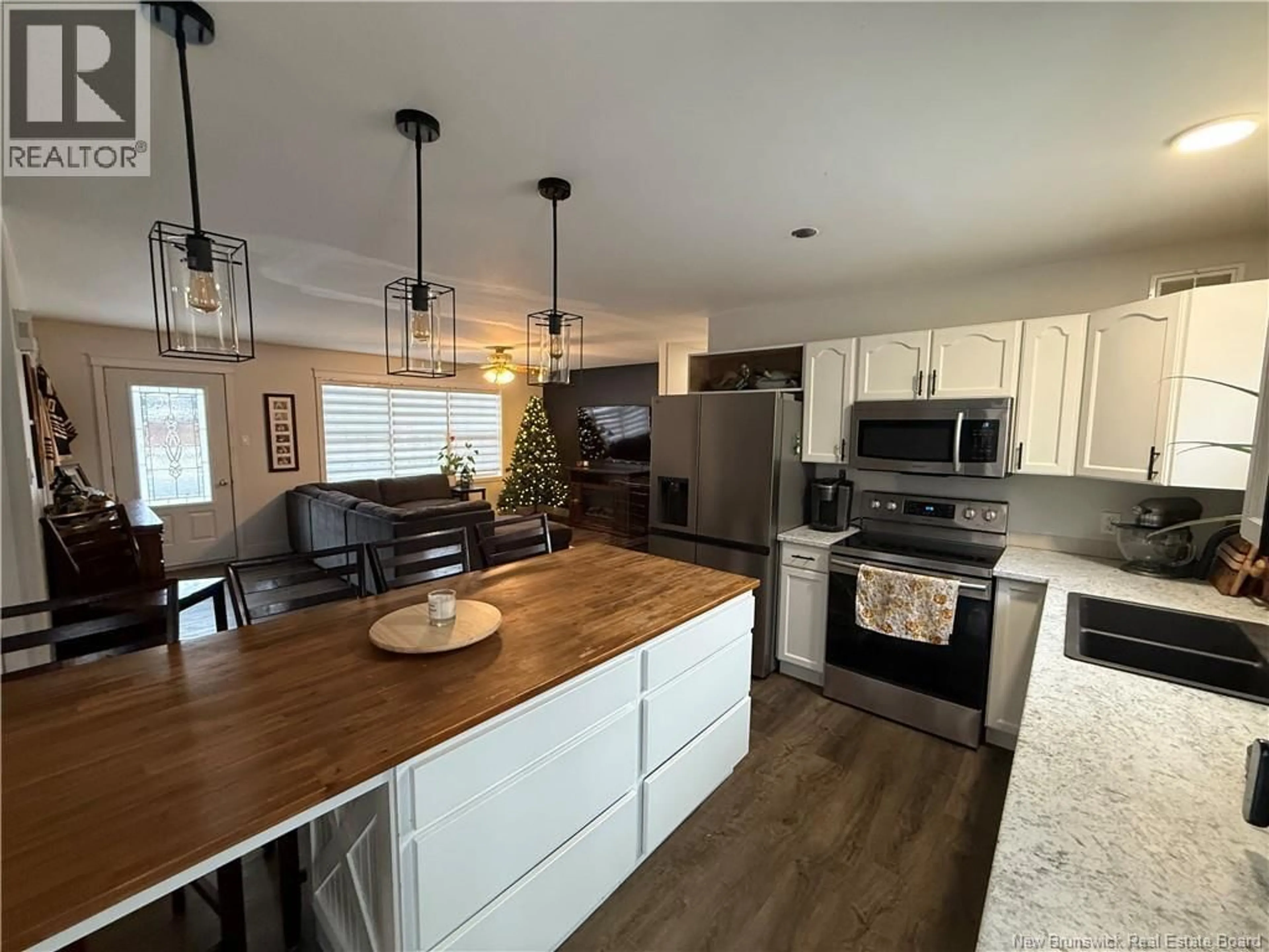Open concept kitchen, wood/laminate floor for 145 EASTWOOD DRIVE, Woodstock New Brunswick E7M1P7