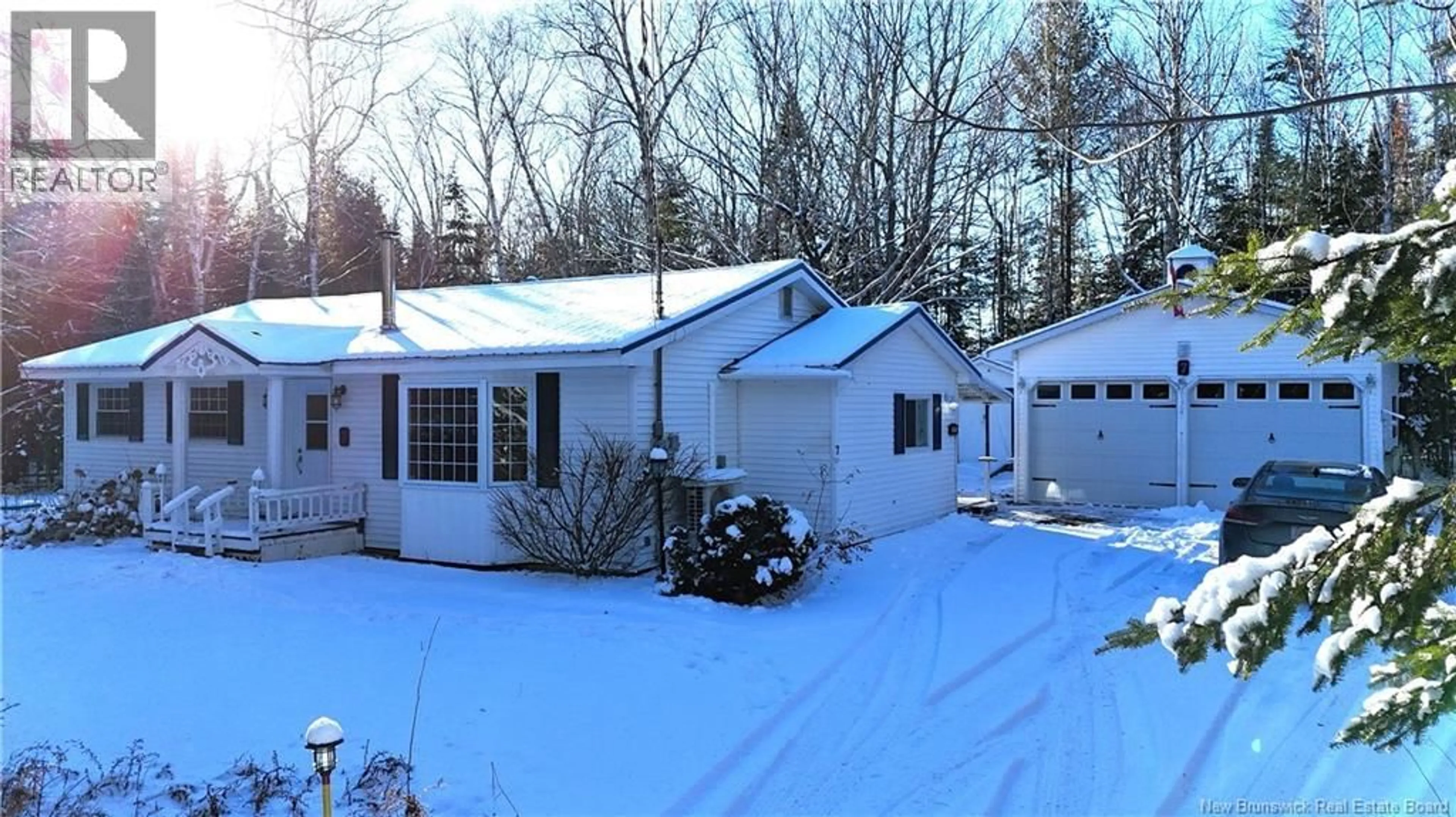 A pic from outside/outdoor area/front of a property/back of a property/a pic from drone, street for 7 BURNETT DRIVE, Hanwell New Brunswick E3C2H8