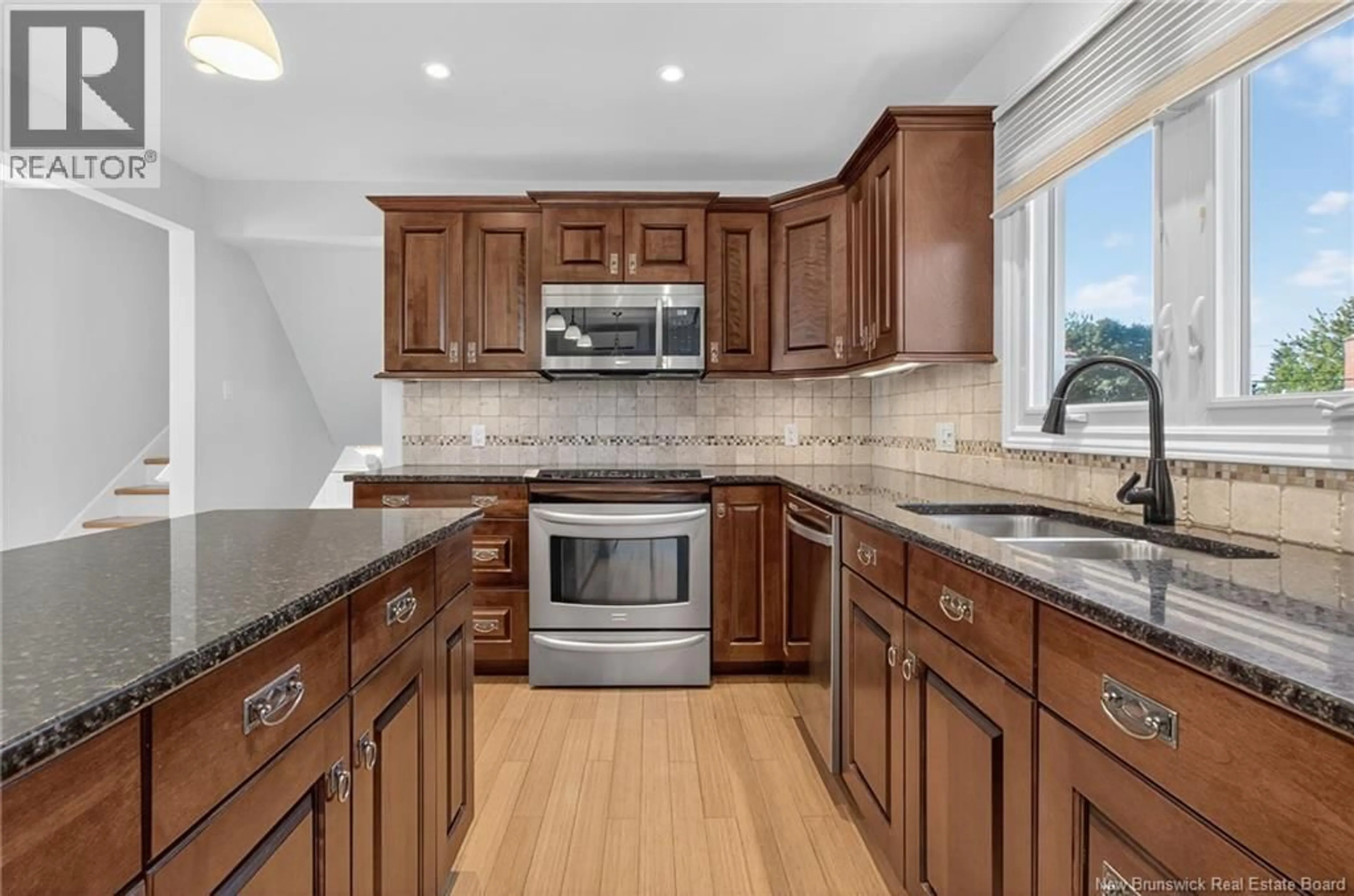 Open concept kitchen, ceramic/tile floor for 100 DICKSON BOULEVARD, Moncton New Brunswick E1E2P8