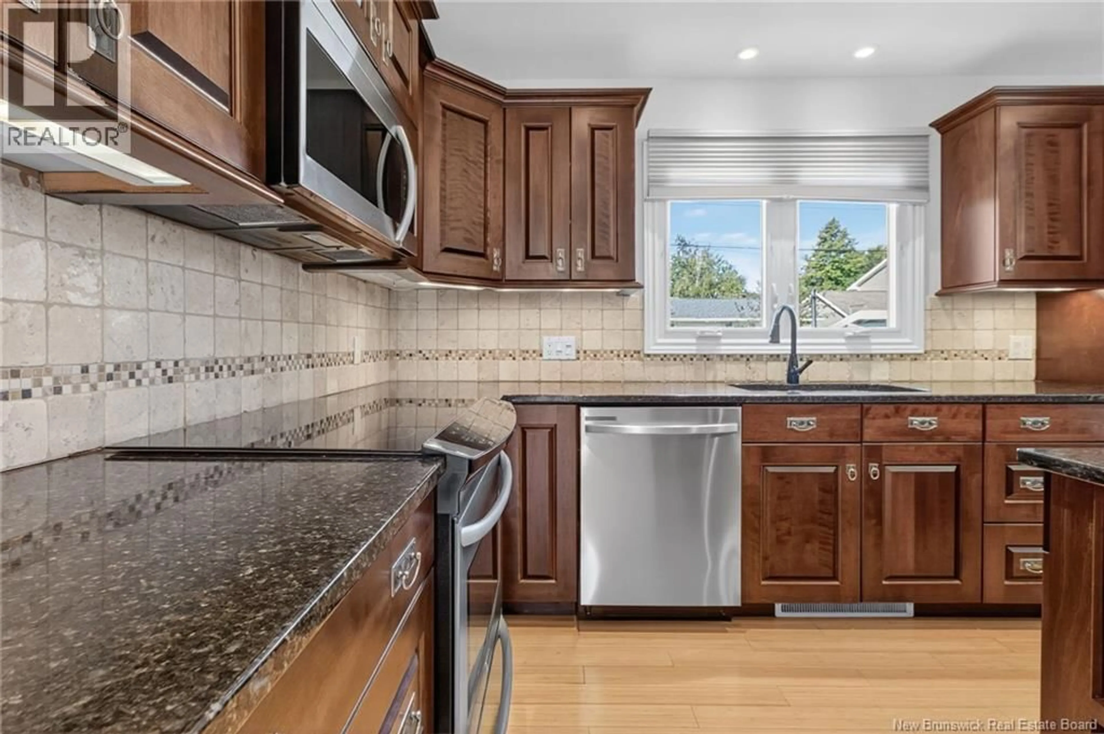 Open concept kitchen, ceramic/tile floor for 100 DICKSON BOULEVARD, Moncton New Brunswick E1E2P8