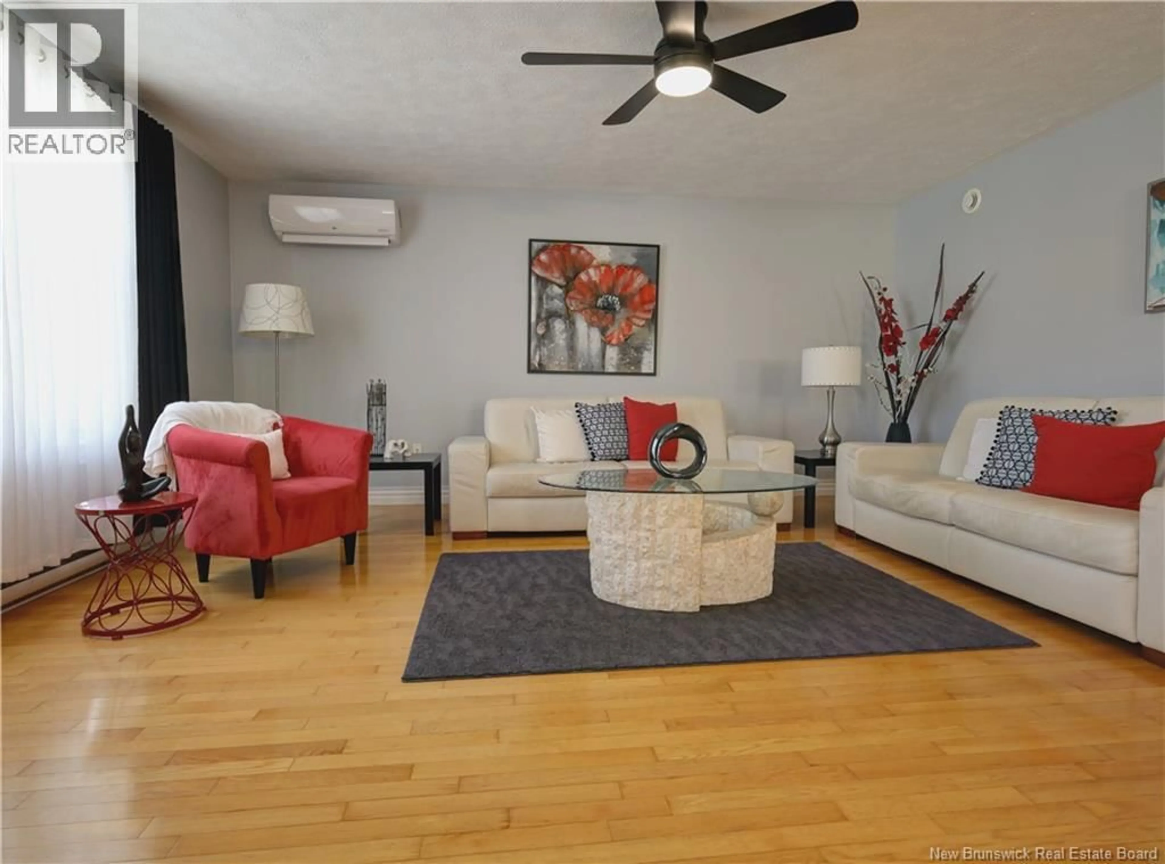 Living room with furniture, wood/laminate floor for 4 WATLING CRESCENT, Oromocto New Brunswick E2V4M7