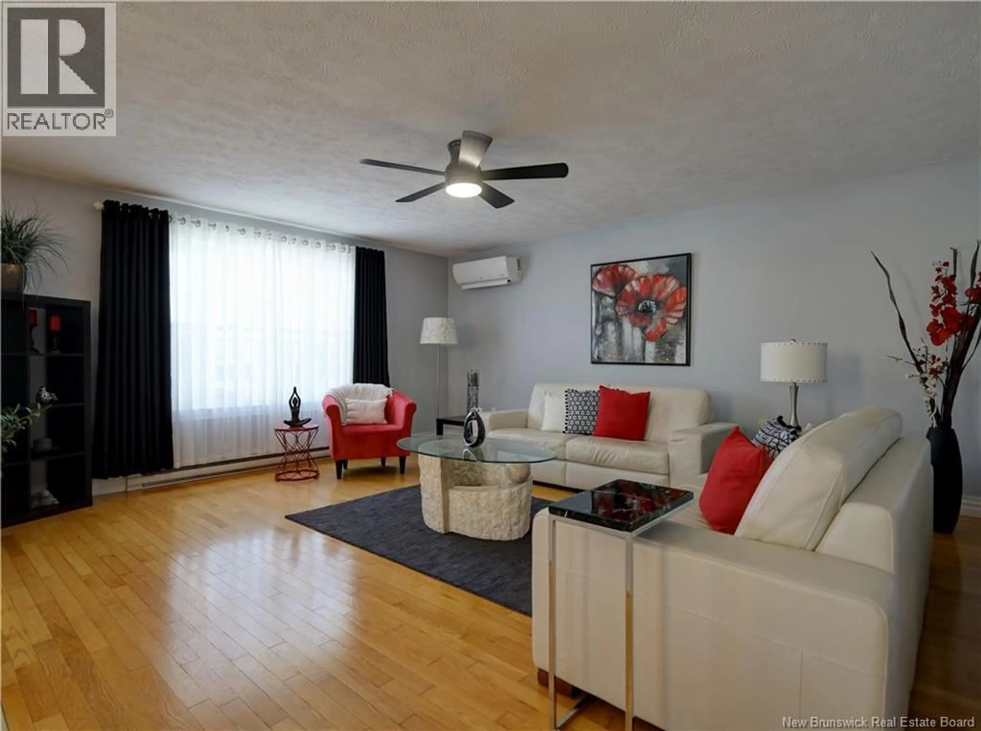 Living room with furniture, wood/laminate floor for 4 WATLING CRESCENT, Oromocto New Brunswick E2V4M7