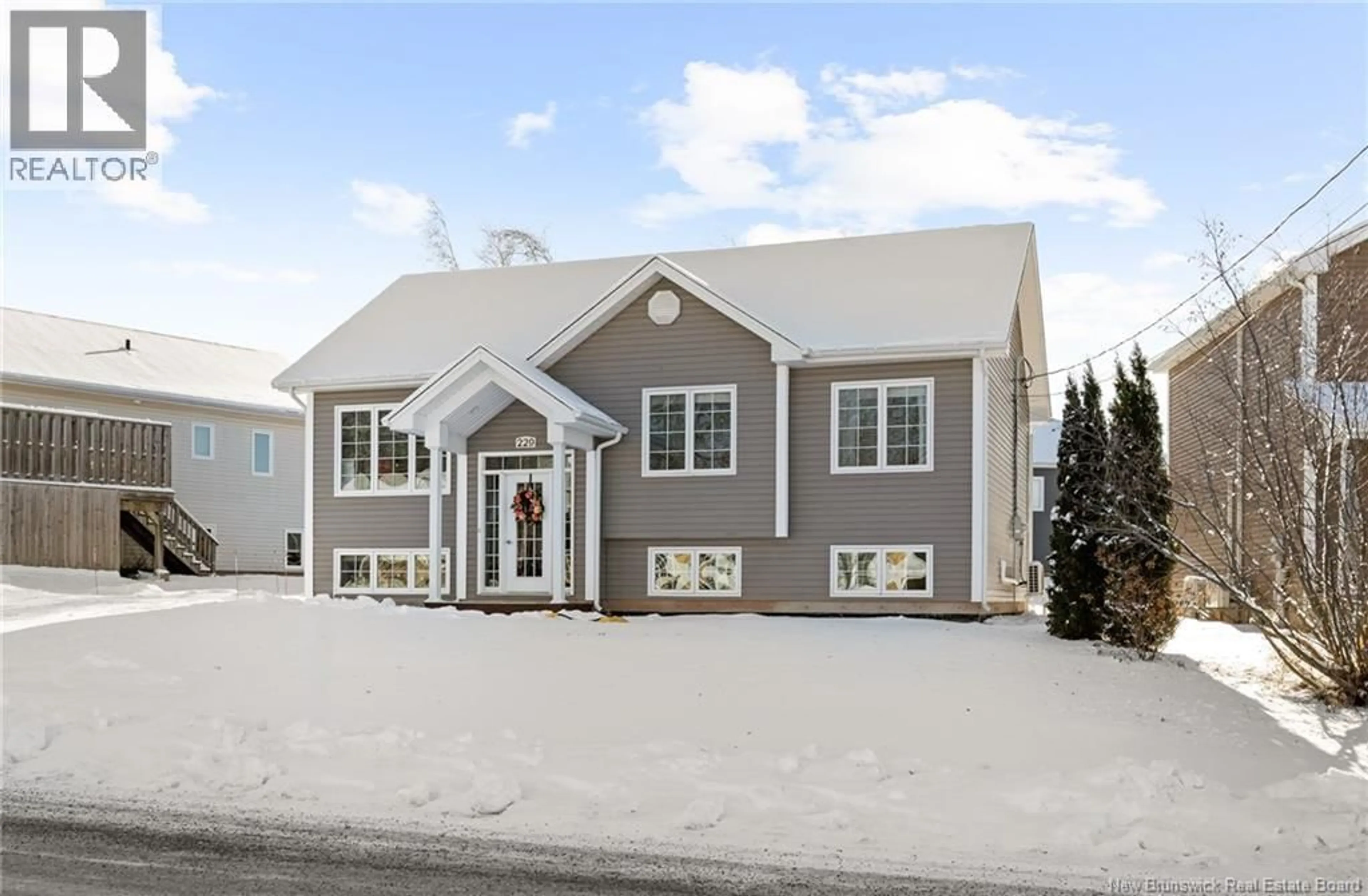 Home with vinyl exterior material, street for 229 DU MOULIN, Dieppe New Brunswick E1A0Y3