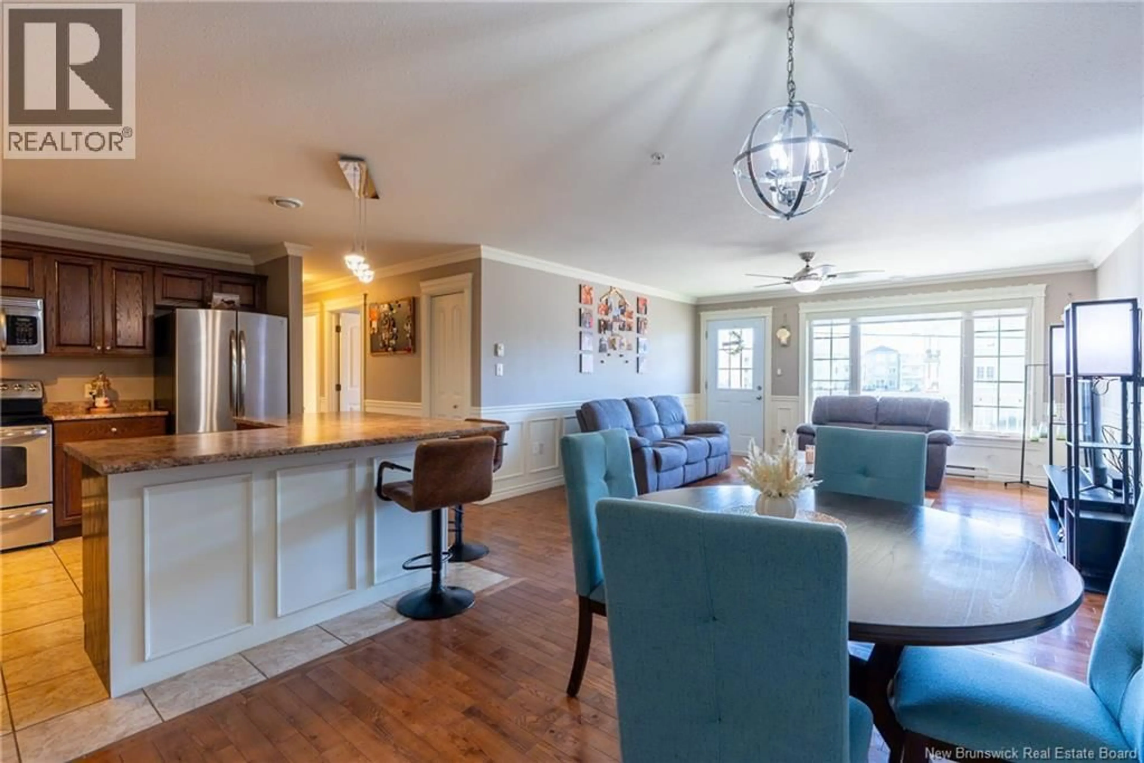 Open concept kitchen, wood/laminate floor for 217 - 165 VALCOUR DRIVE, Fredericton New Brunswick E3C0H5