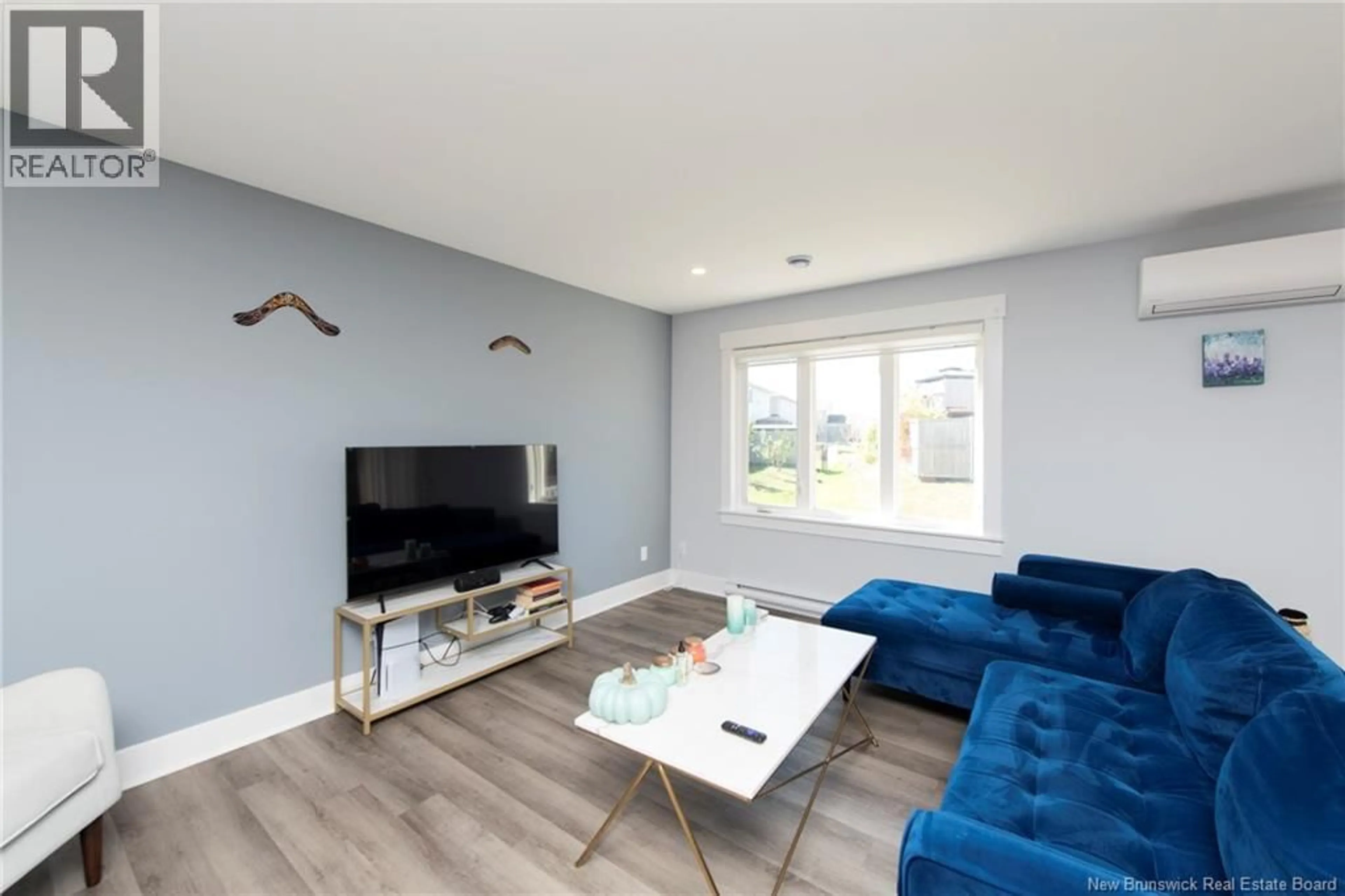 Living room with furniture, wood/laminate floor for 24 SATLEVILLE CRESCENT, Riverview New Brunswick E1B0W2