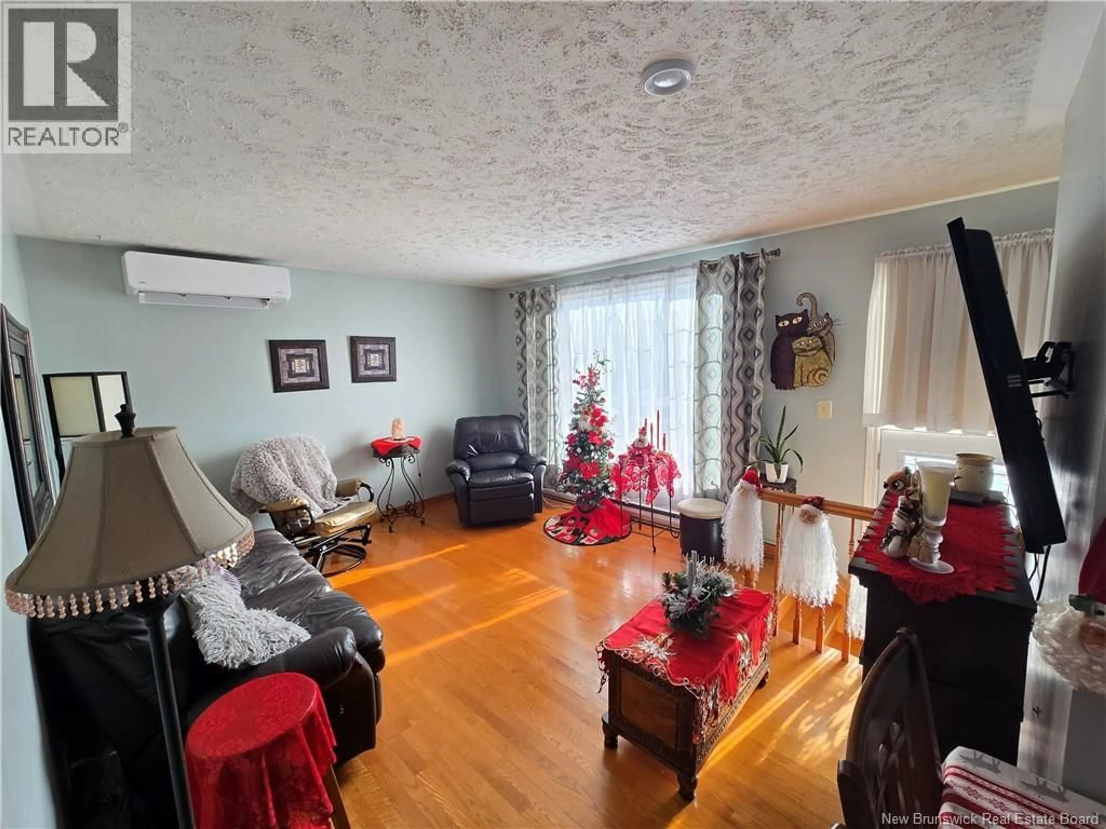 Living room with furniture, unknown for 210 FRANCINE, Beresford New Brunswick E8K1N8