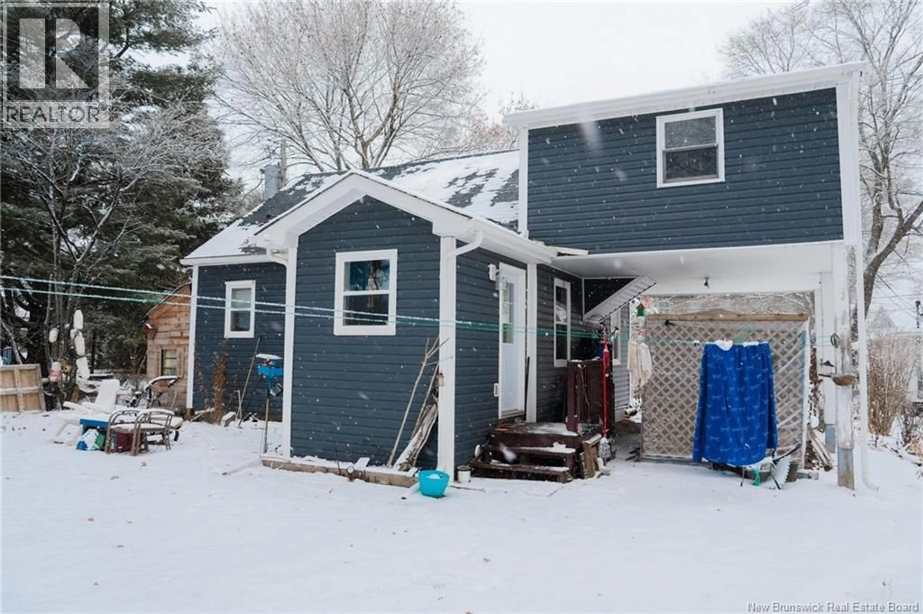 Home with vinyl exterior material, street for 8 RUE DE LEGLISE, Bouctouche New Brunswick E4S2Z7