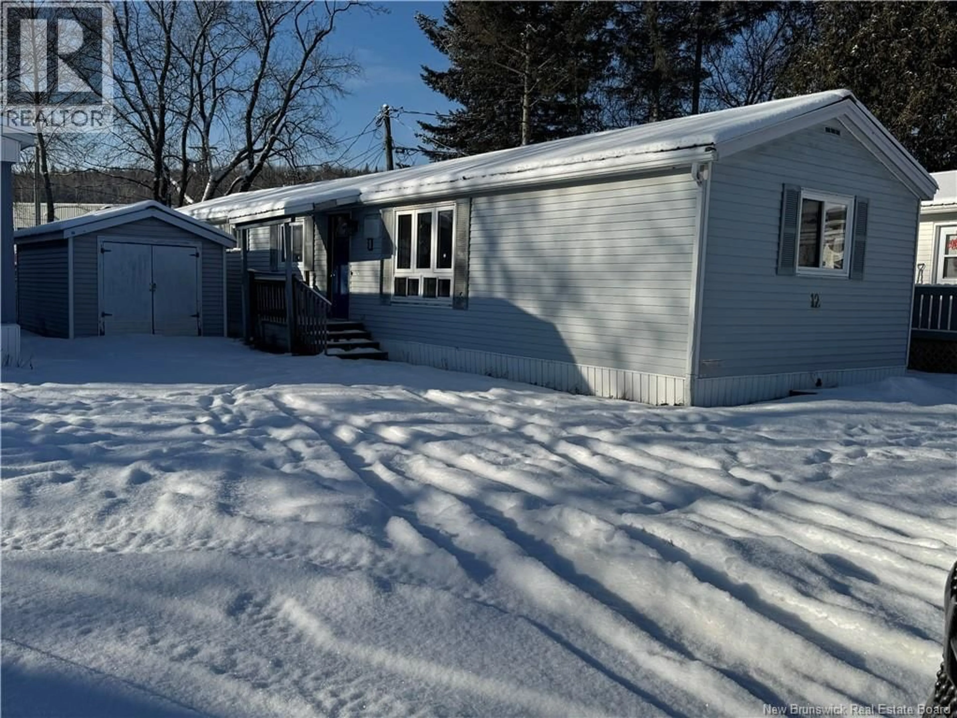Home with vinyl exterior material, street for 12 POULIN DRIVE, Woodstock New Brunswick E7M2L8