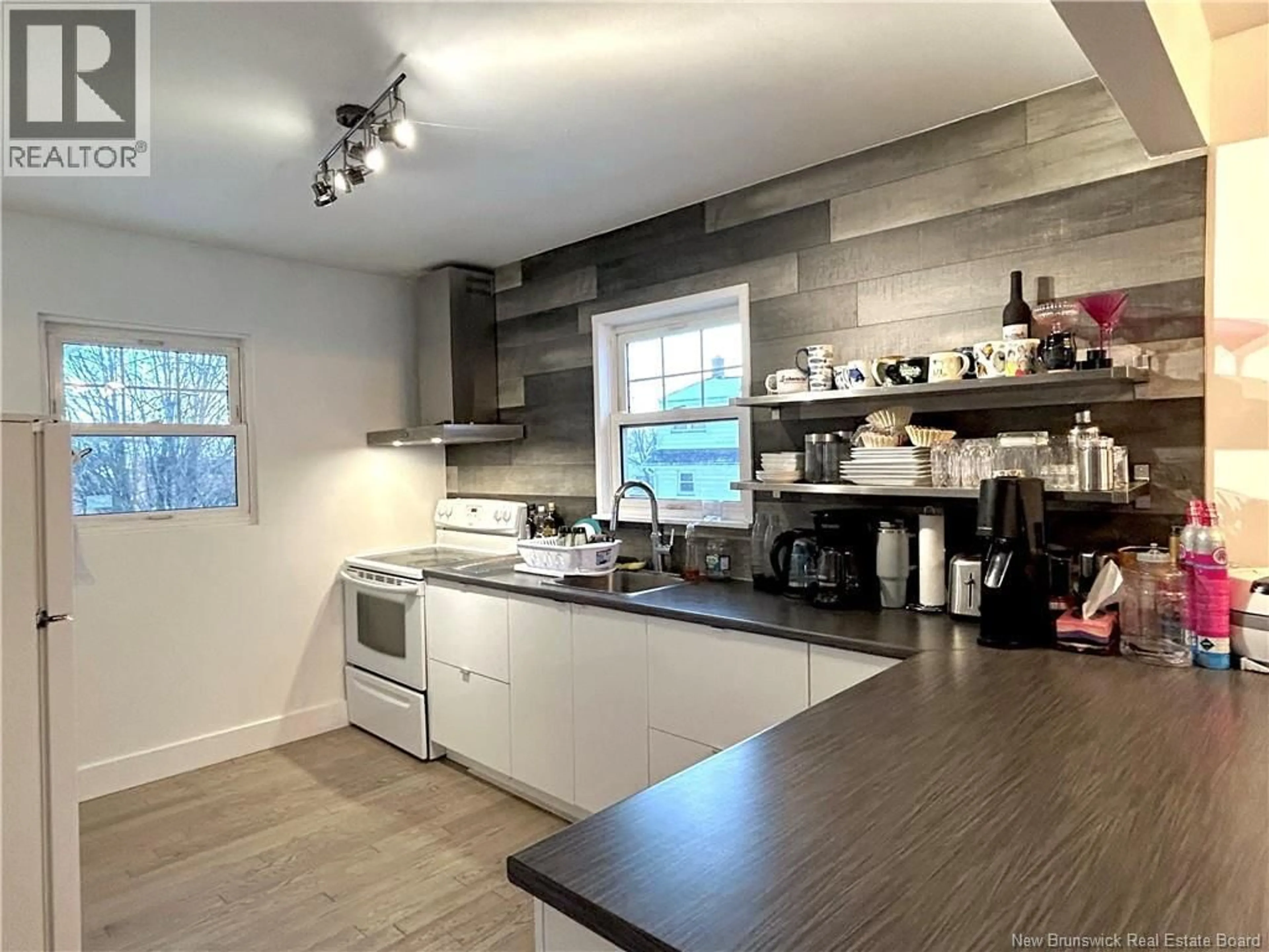 Open concept kitchen, wood/laminate floor for 740 KING GEORGE HWY, Miramichi New Brunswick E1V1P8