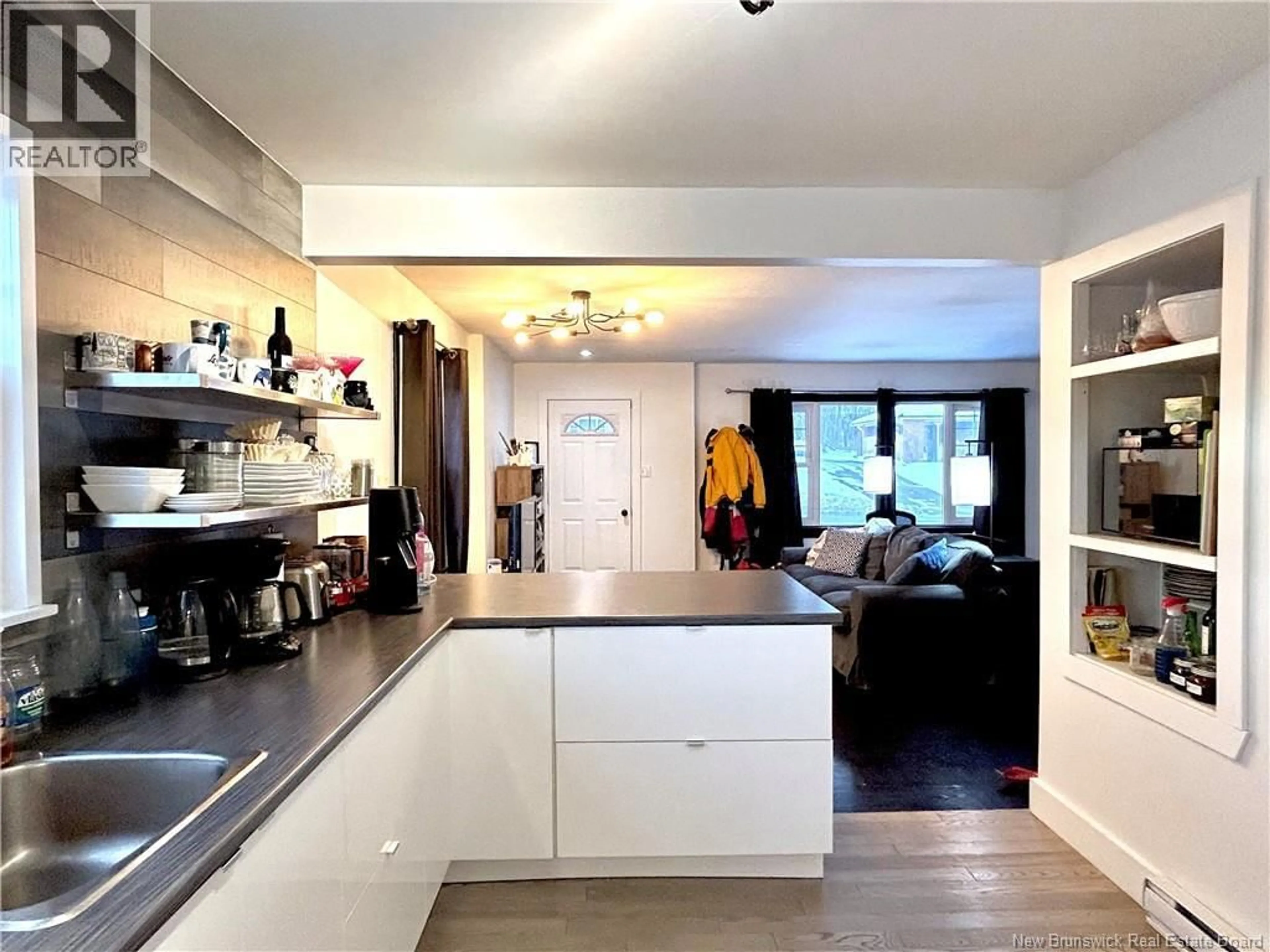 Open concept kitchen, wood/laminate floor for 740 KING GEORGE HWY, Miramichi New Brunswick E1V1P8