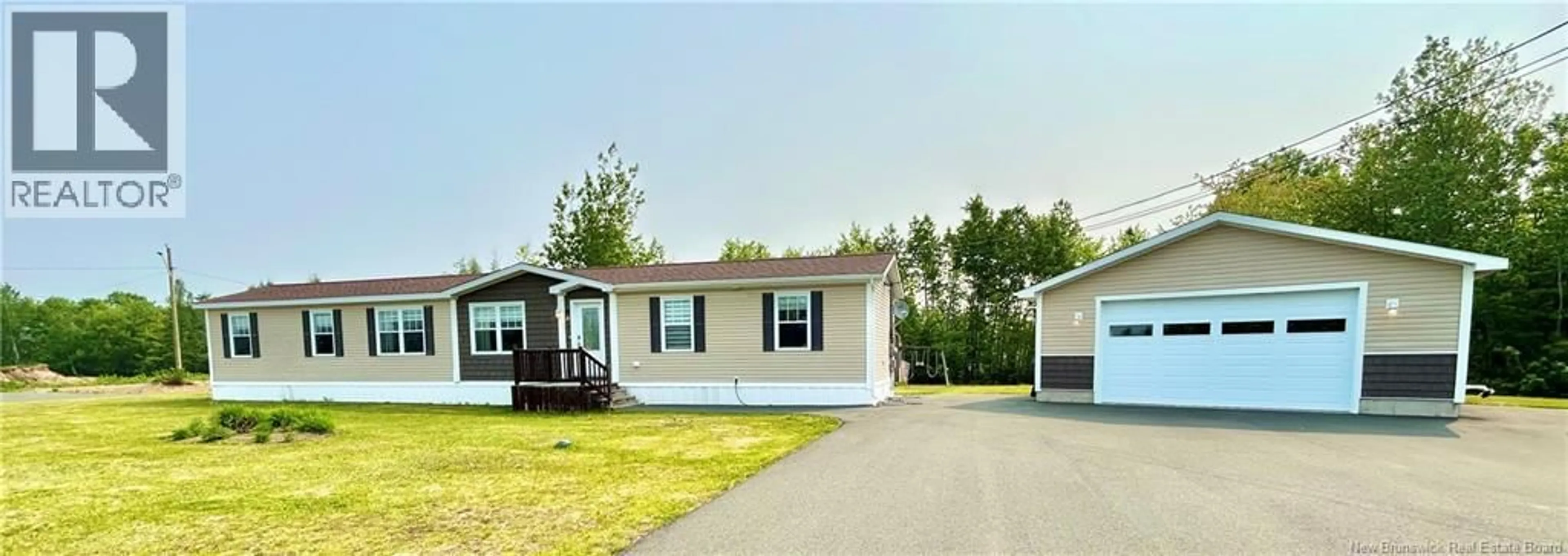 Home with vinyl exterior material, street for 6 DONAT STREET, Saint-Isidore New Brunswick E8M0A5