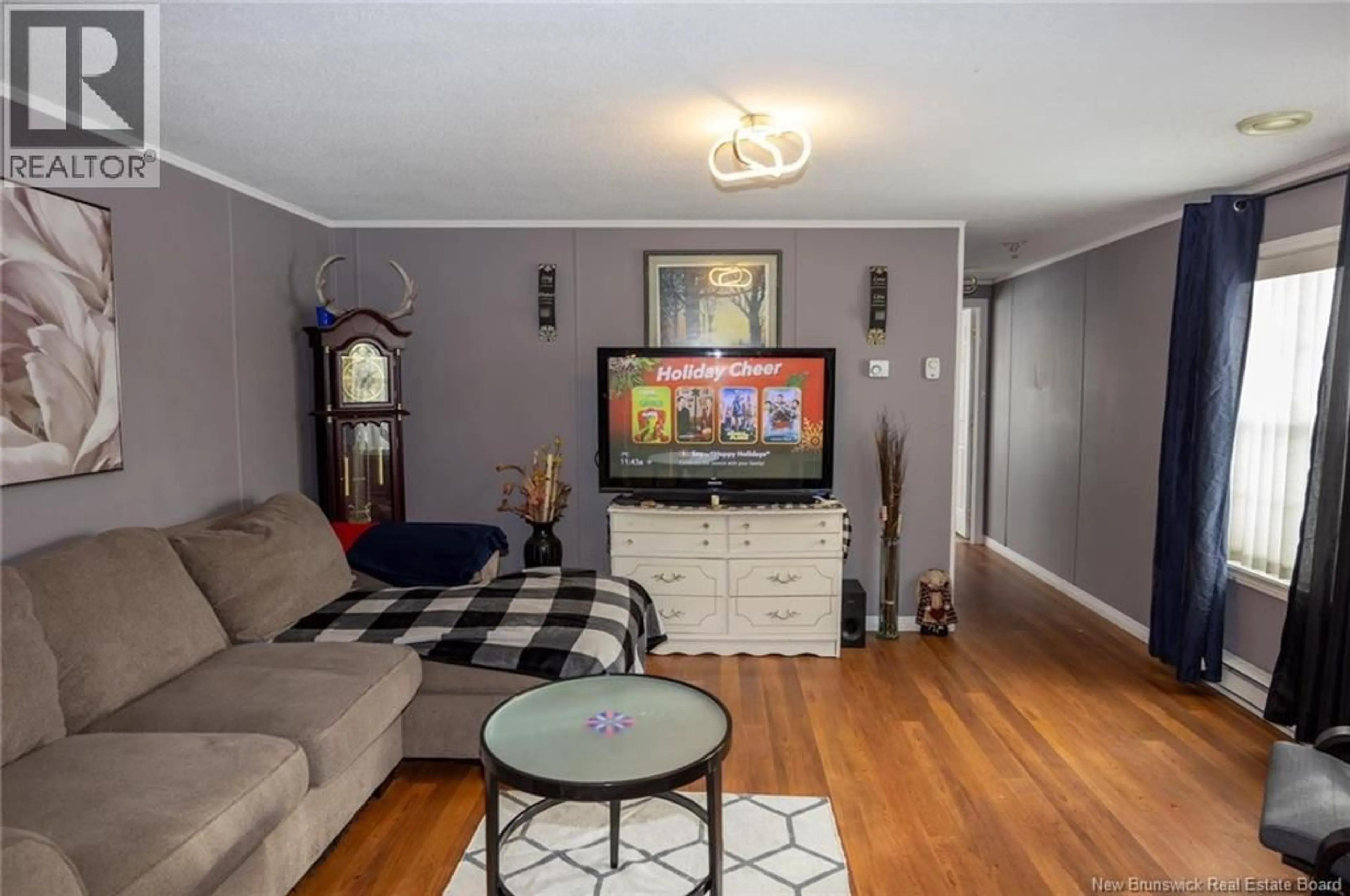 Living room with furniture, wood/laminate floor for 95 NORTHWOOD STREET, Fredericton New Brunswick E3B6B4