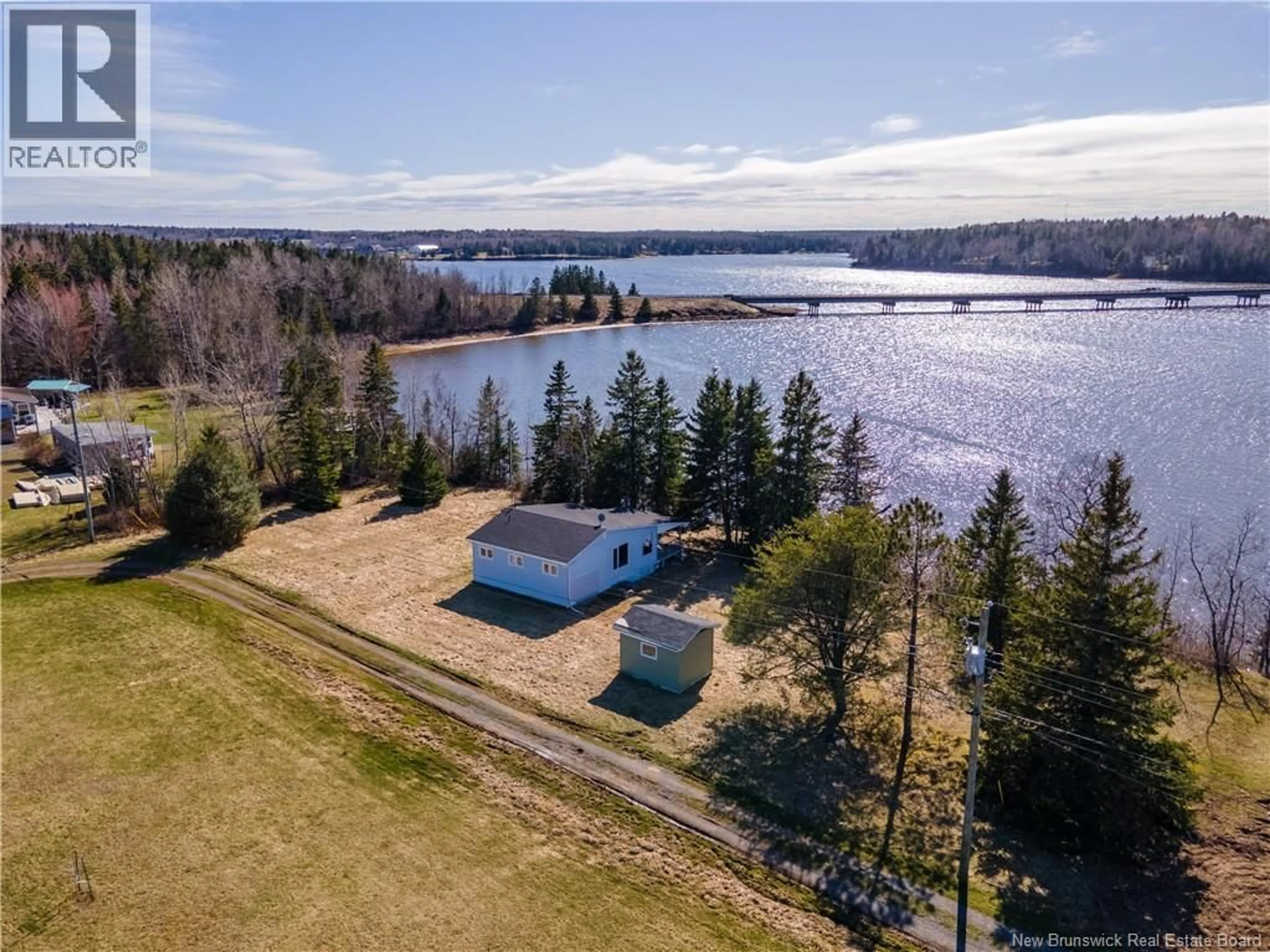 A pic from outside/outdoor area/front of a property/back of a property/a pic from drone, water/lake/river/ocean view for 31 RITA ROAD, Bouctouche New Brunswick E4S3X7