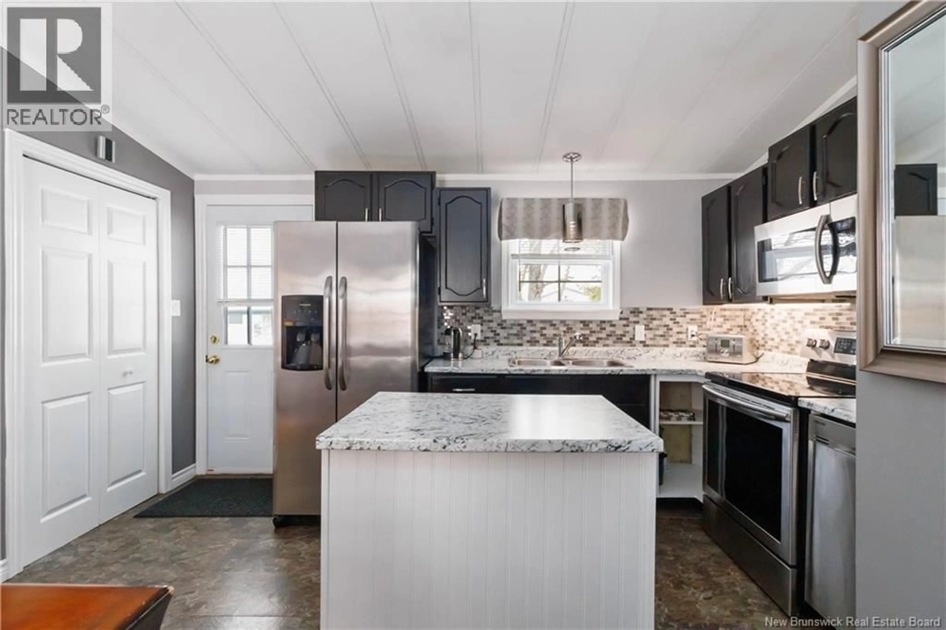 Open concept kitchen, ceramic/tile floor for 10 SPRUCE WOOD STREET, Moncton New Brunswick E1H3B3