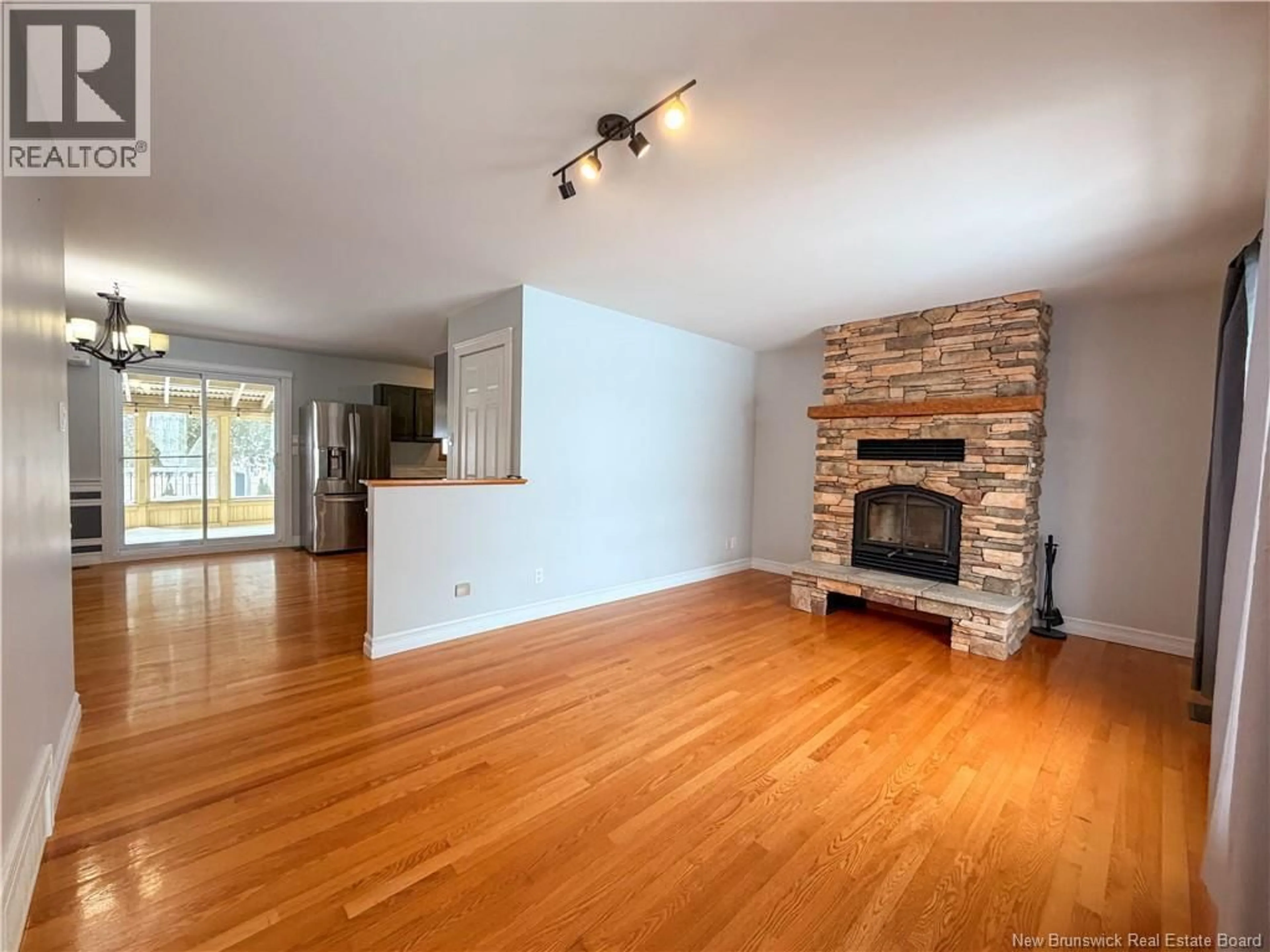 Living room with furniture, wood/laminate floor for 4 YORSDUN COURT, Campbellton New Brunswick E3N3N9