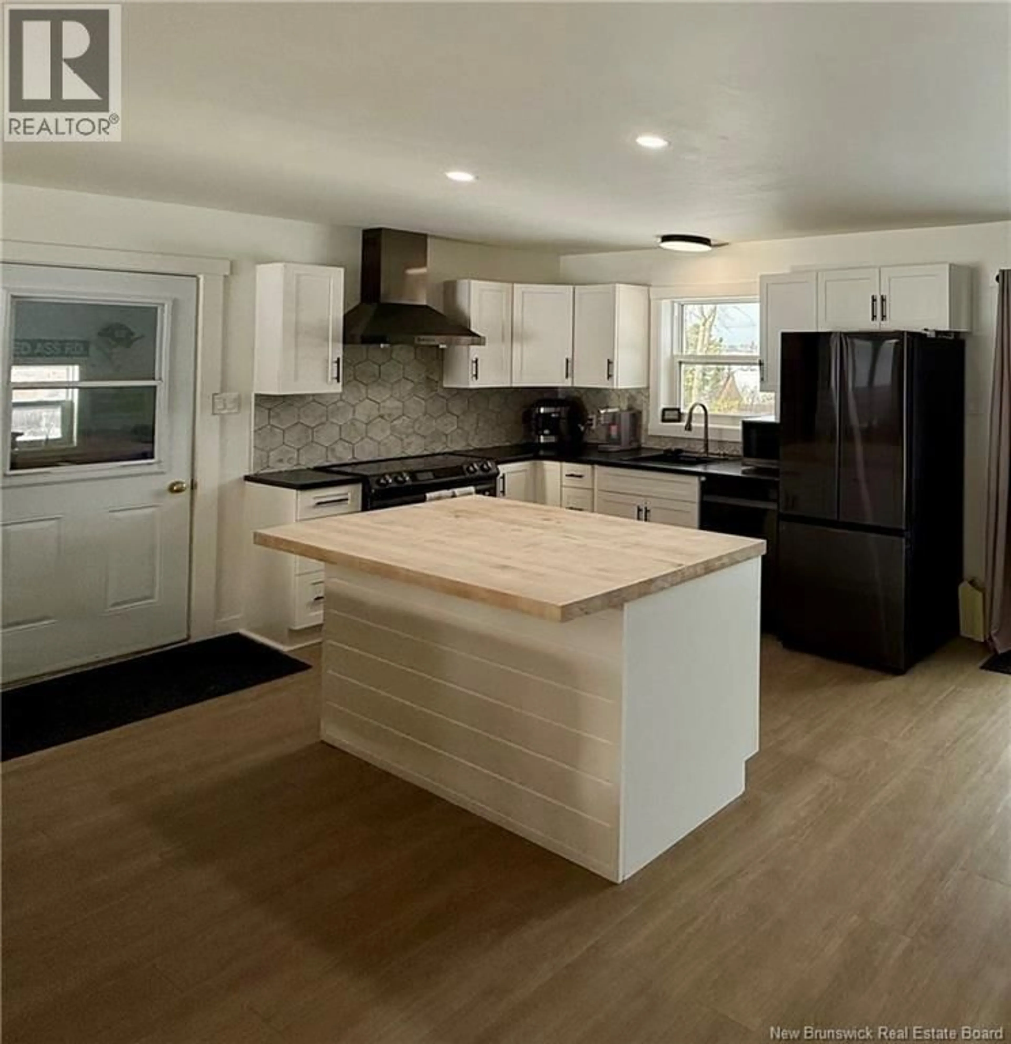 Open concept kitchen, wood/laminate floor for 400 RTE 420, South Esk New Brunswick E1V3M3