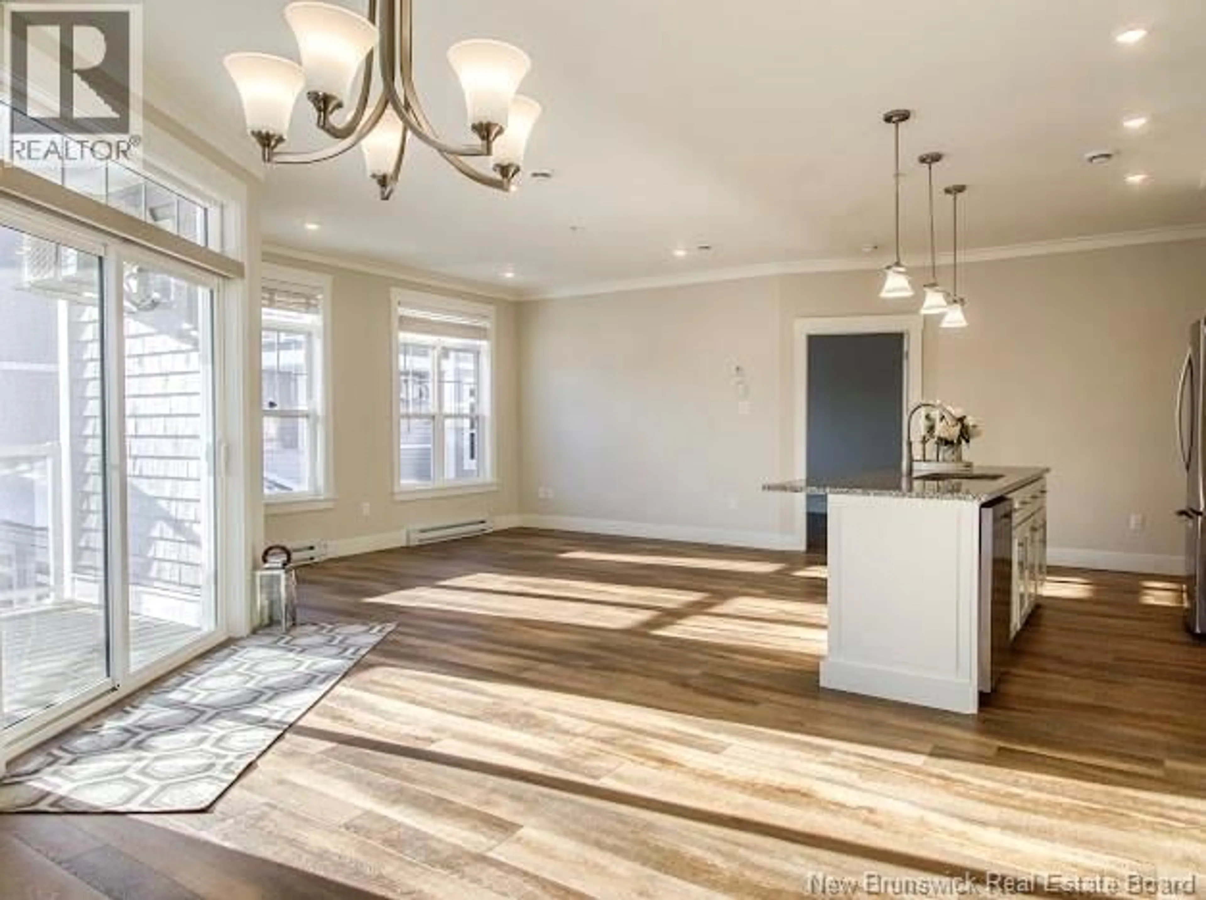 Open concept kitchen, wood/laminate floor for 208 - 54 HAMPTON ROAD, Rothesay New Brunswick E2E0V5