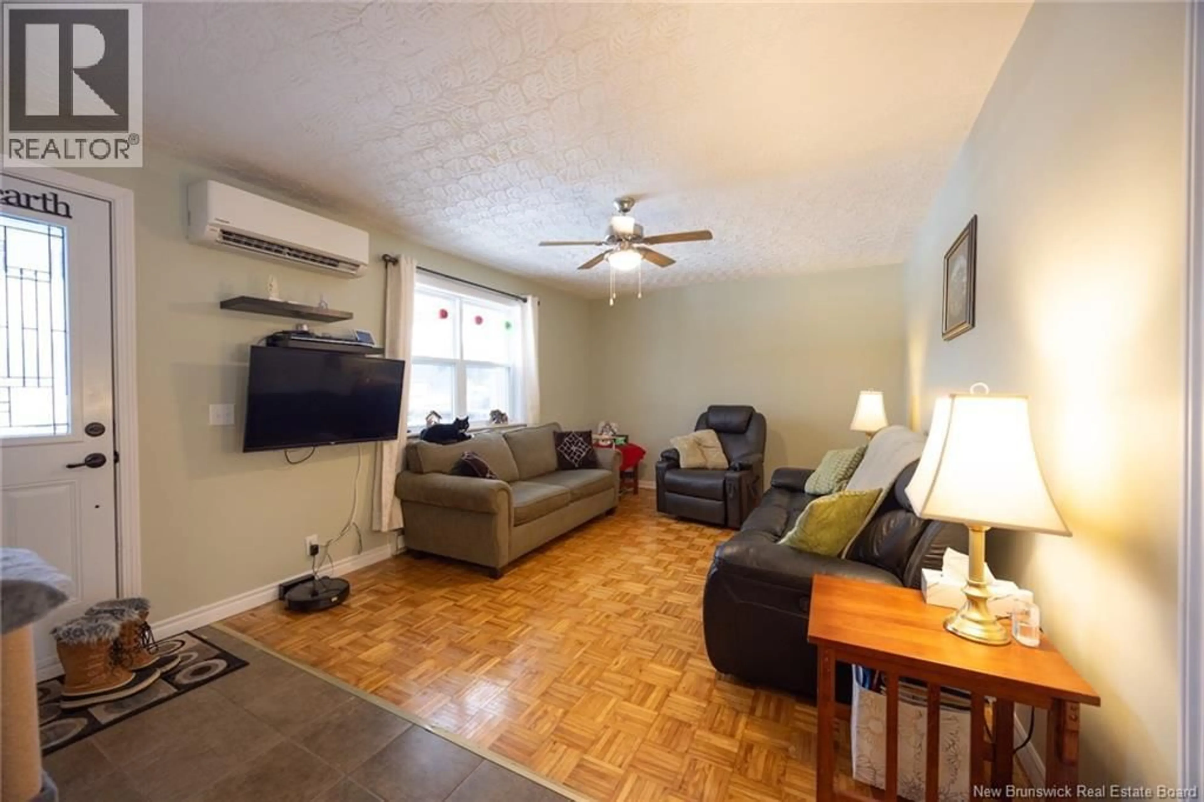 Living room with furniture, wood/laminate floor for 626 BROOKSIDE DRIVE, Fredericton New Brunswick E3A8V2
