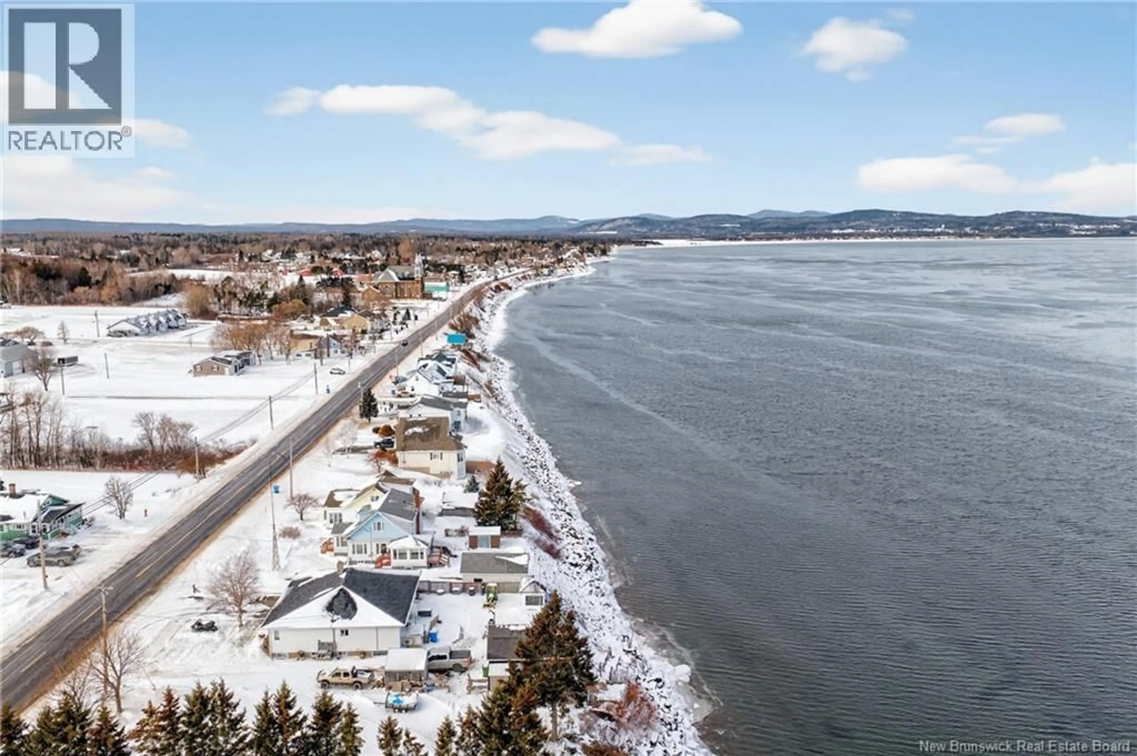 A pic from outside/outdoor area/front of a property/back of a property/a pic from drone, water/lake/river/ocean view for 379 CHALEUR STREET, Charlo New Brunswick E8E2B8