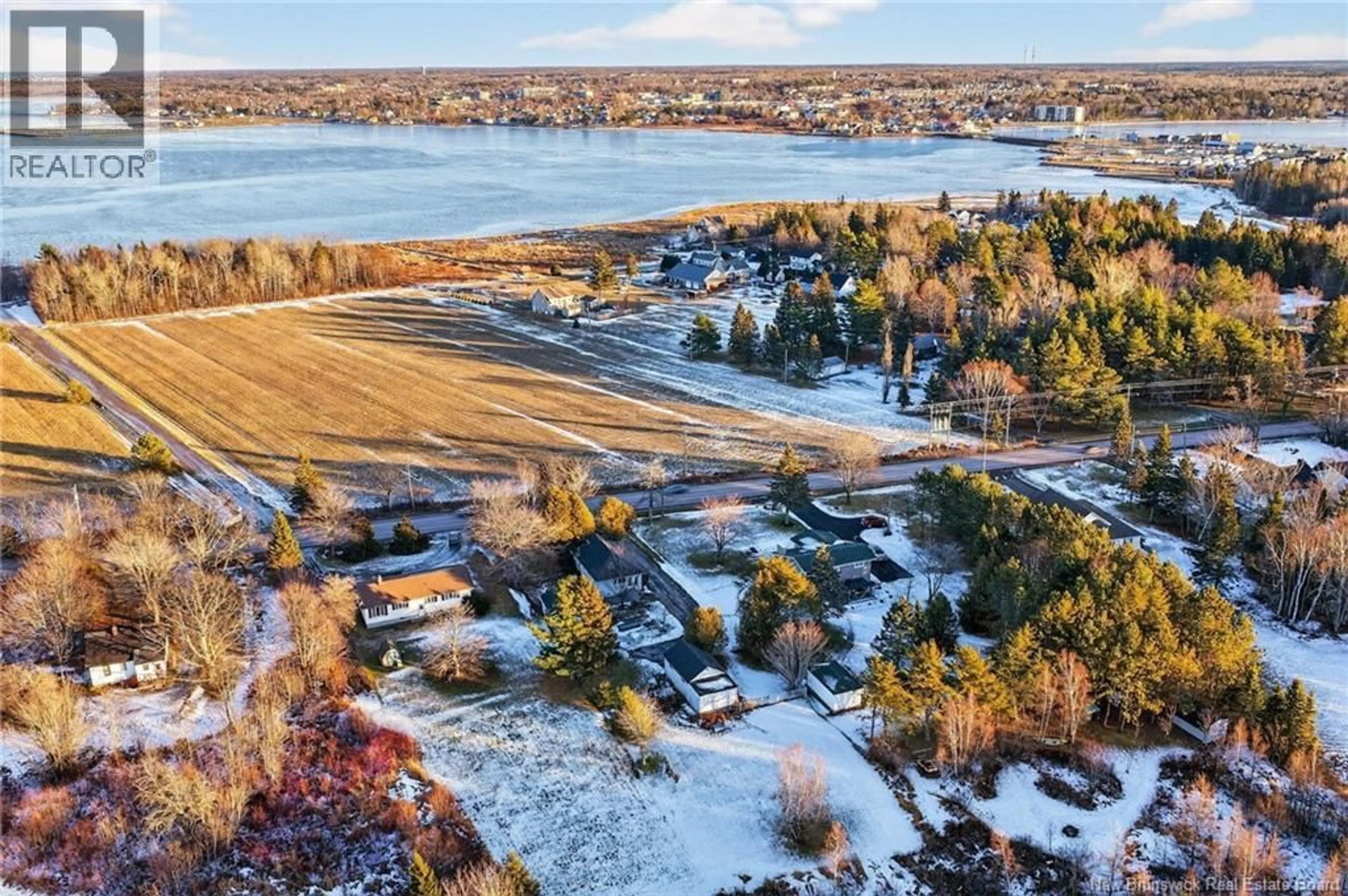 A pic from outside/outdoor area/front of a property/back of a property/a pic from drone, water/lake/river/ocean view for 55 ROUTE 133, Shediac Cape New Brunswick E4P3C8
