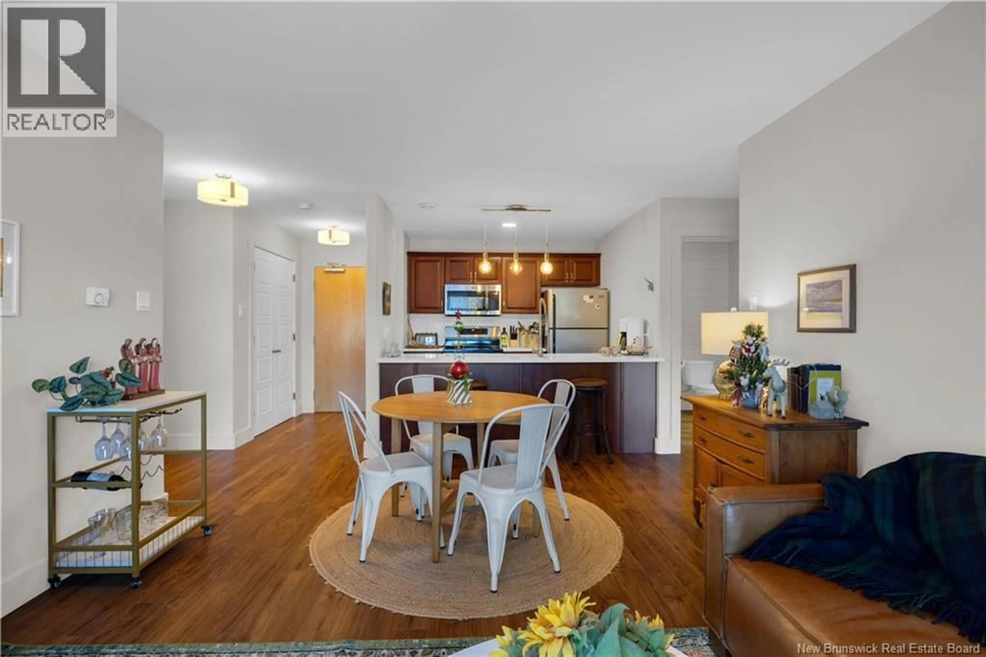 Open concept kitchen, wood/laminate floor for 214 - 130 ARLINGTON CRESCENT CRESCENT, Saint John New Brunswick E2K0J1