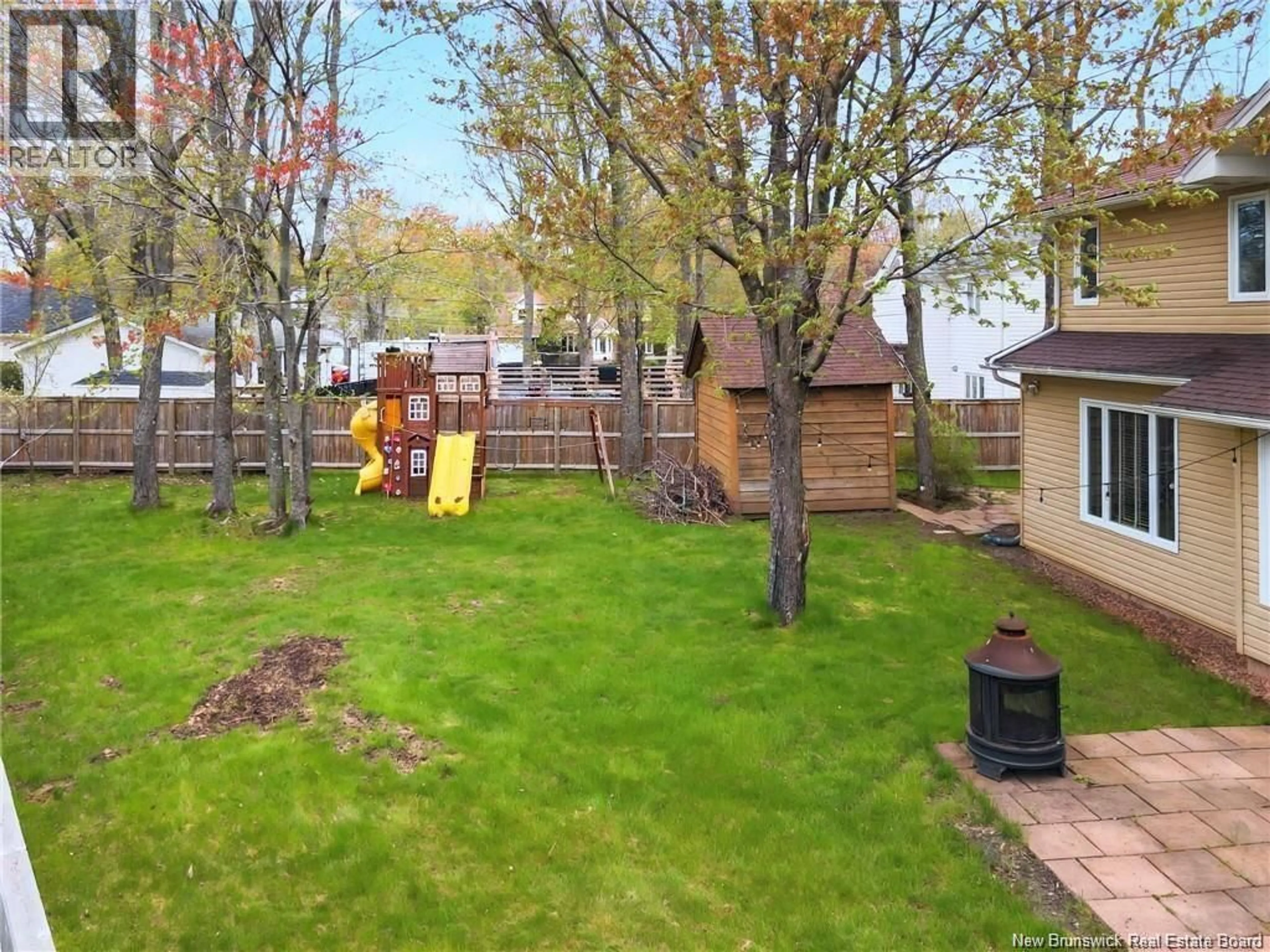 A pic from outside/outdoor area/front of a property/back of a property/a pic from drone, forest/trees view for 84 LINDEN CRESCENT, Moncton New Brunswick E1B2B2